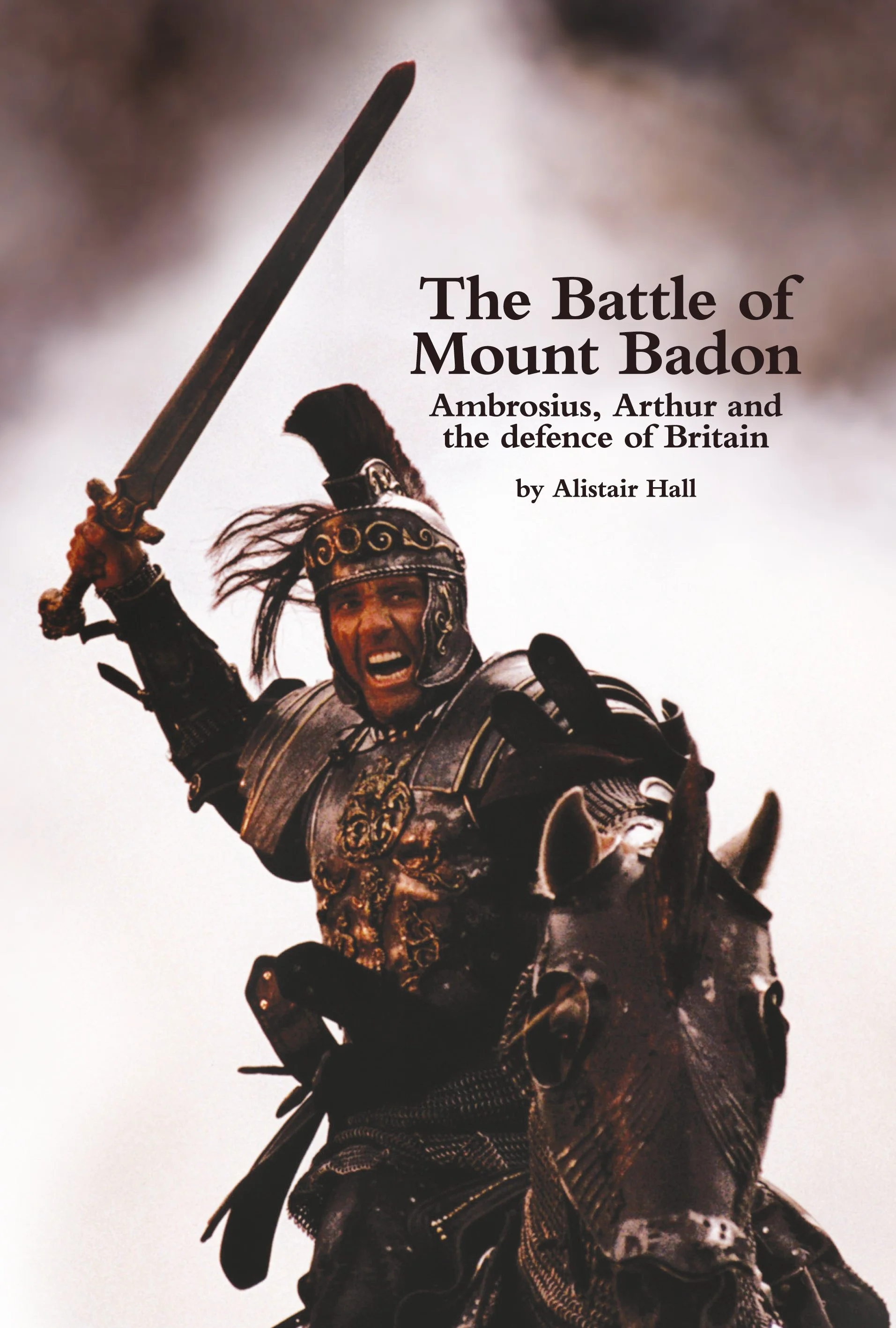 The cover of nonfiction book The Battle of Mount Badon: Ambrosius, Arthur and the defence of Britain by Alistair Hall. The cover image shows an image of Clive Owen as King Arthur in the 2004 film.