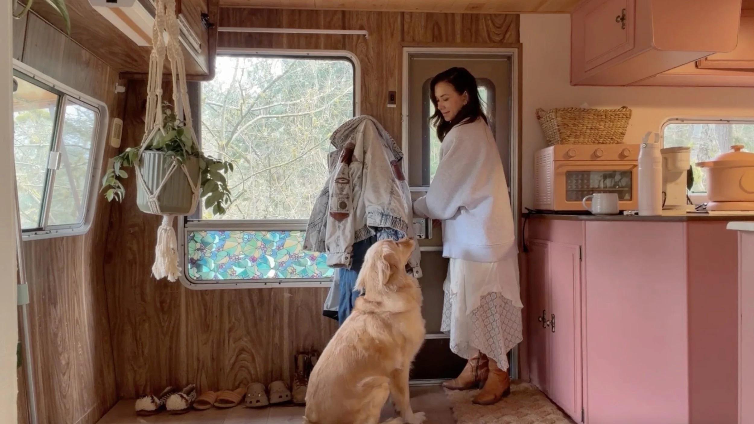 Woman in her 40s starting over, living in a renovated RV forest cottage with dog, simple intentional living lifestyle