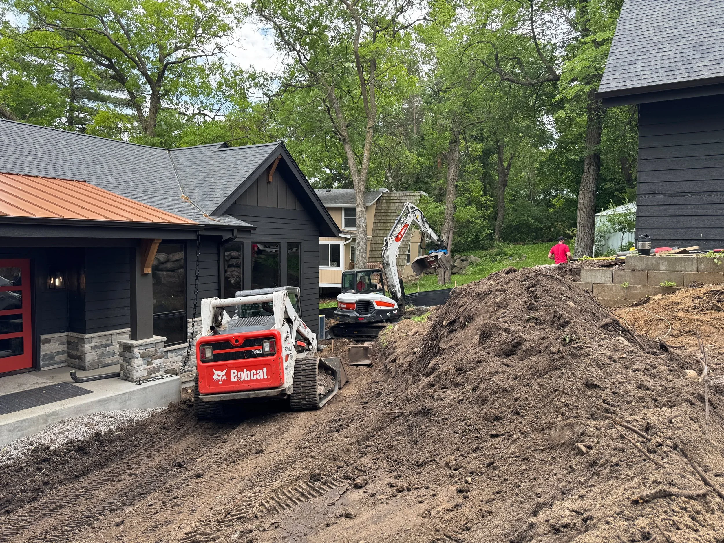 We are so existed to put the finishing touches on this stunning new home built by @revolutiondesignbuild on Lake Sylvia, with landscaping featuring weathering steel and boulder retaining walls, beautiful paver walkways and patios, granite steps and m