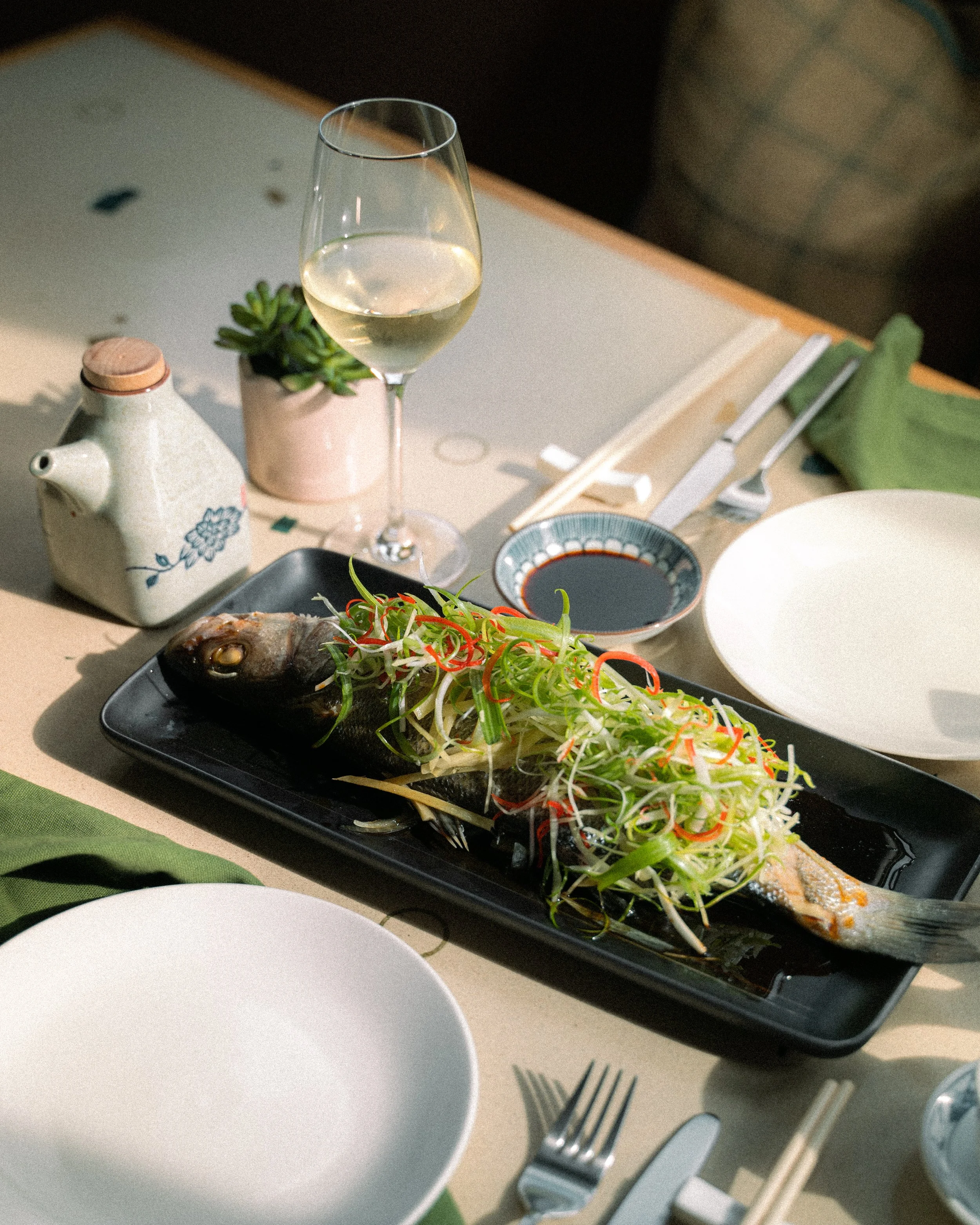 Sea bass with a glass of white wine