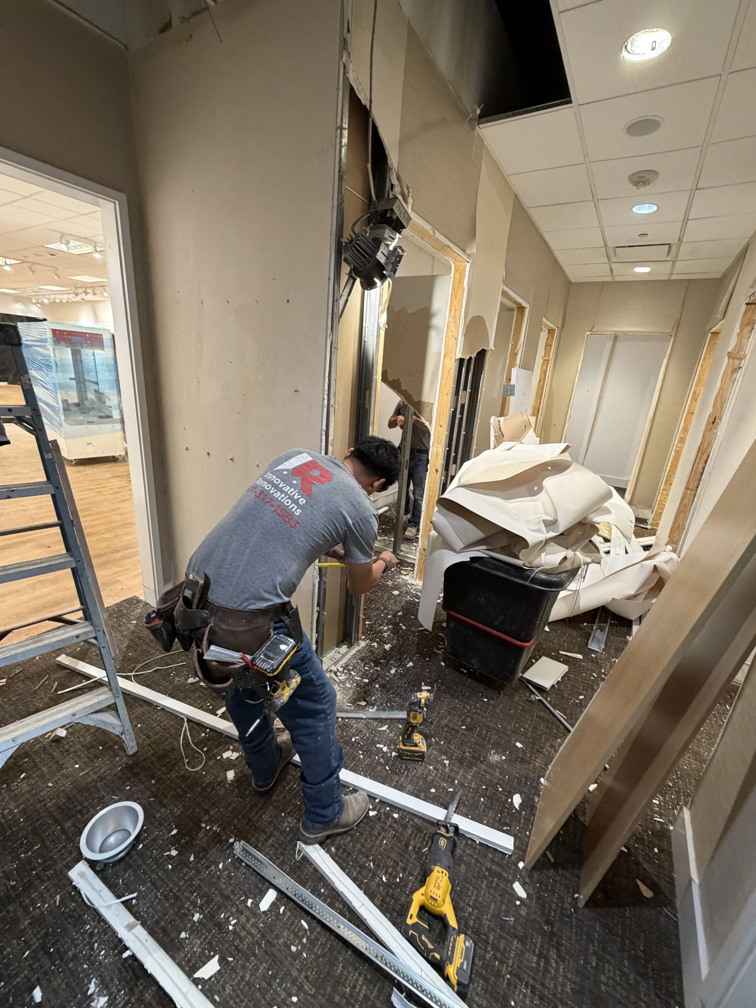 Commercial renovation project in process demoing old fitting rooms