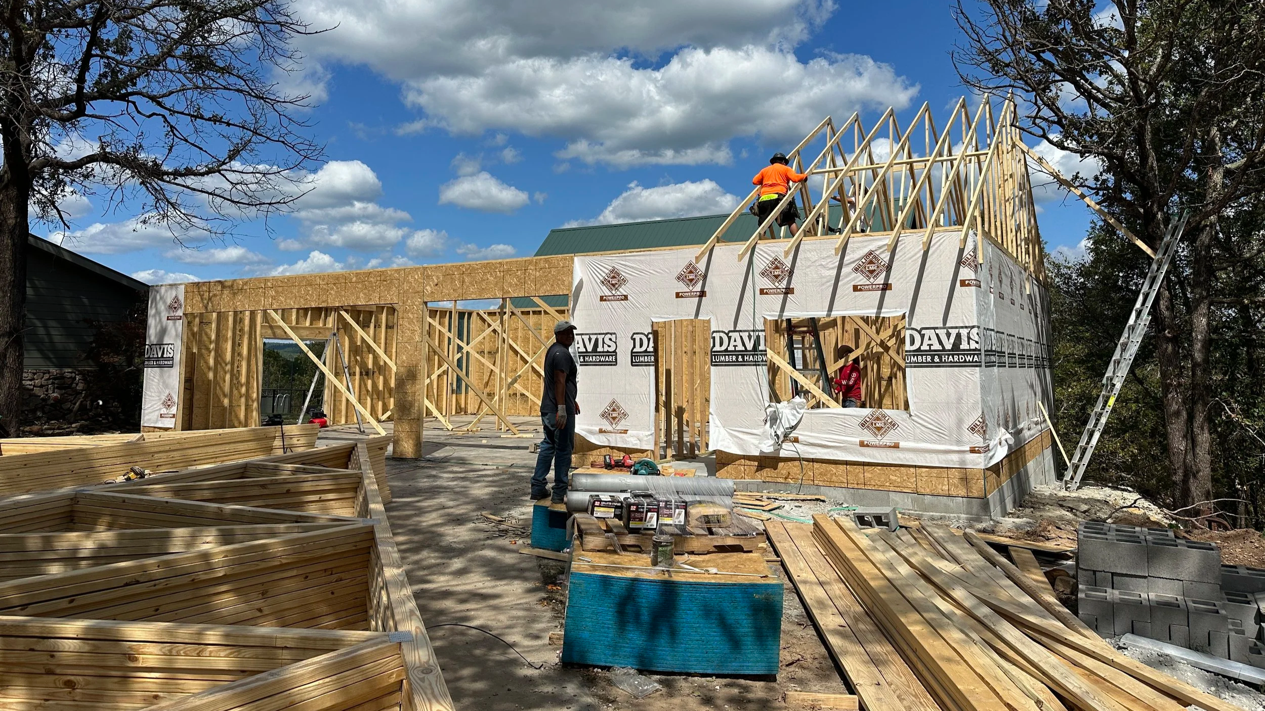 Photo of framing process on a four car detached garage and salon studio. 
