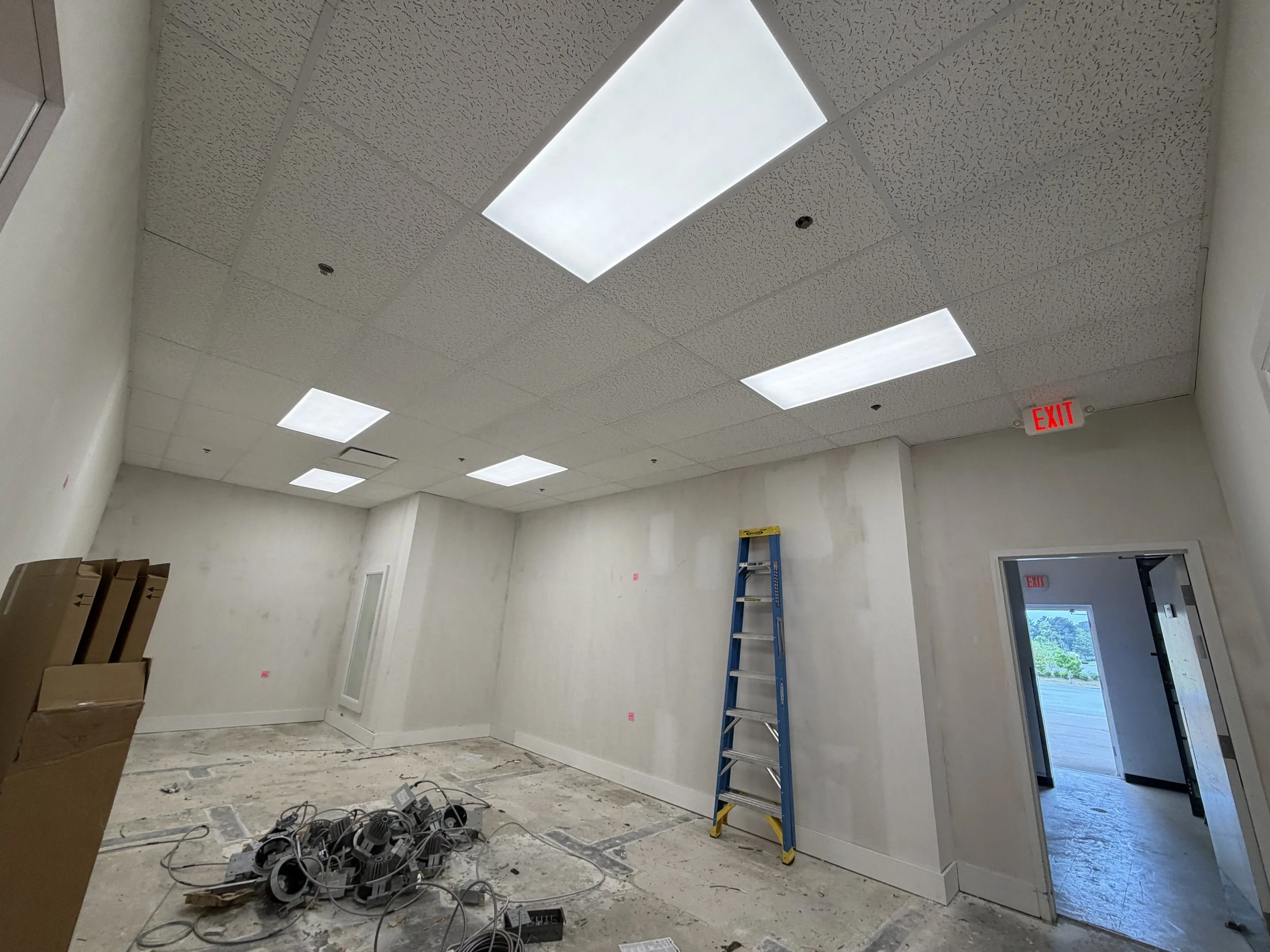 New commercial space in progress with drop ceiling installation