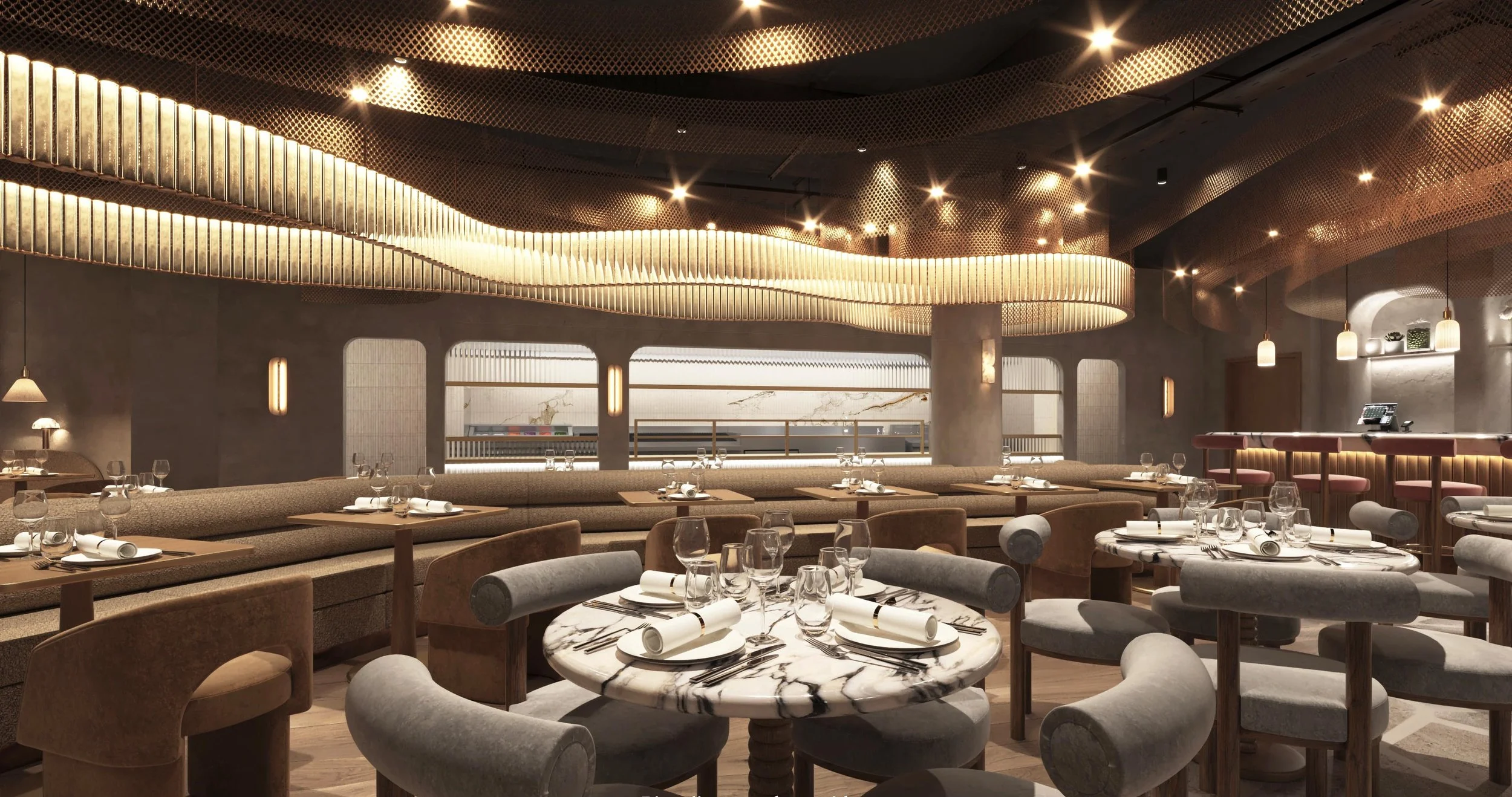 Interior of a modern restaurant with round tables set with wine glasses, napkins, and cutlery, featuring a warm lighting, plush chairs, and decorative ceiling design.