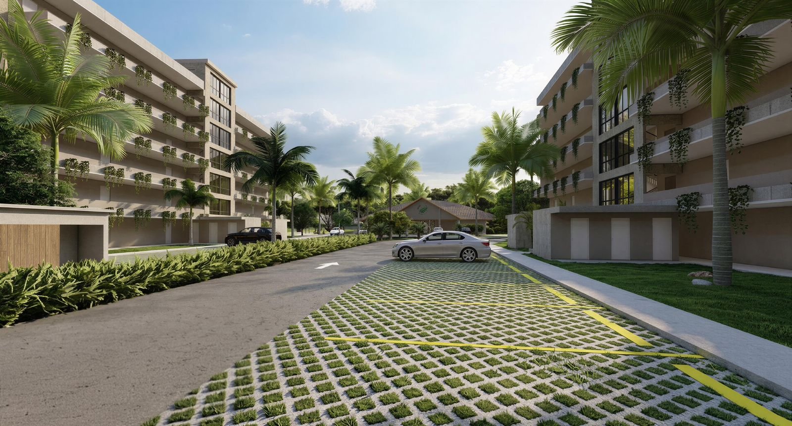 Modern apartment complex with tall buildings, lush green palm trees, and a parking lot with cars. Clear sky with some clouds in the background.
