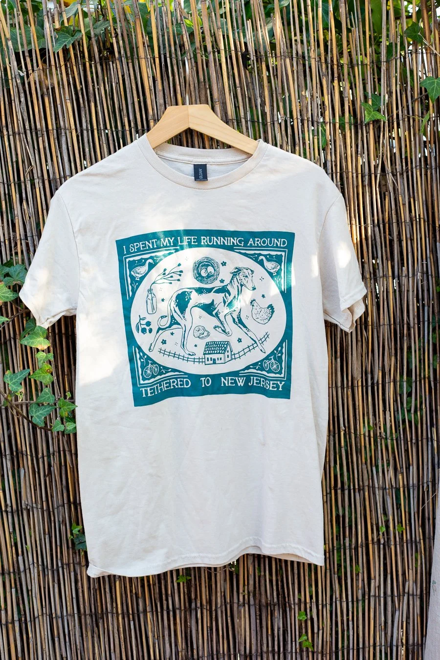 I spent my life running around tethered to New Jersey t-shirt in Sand