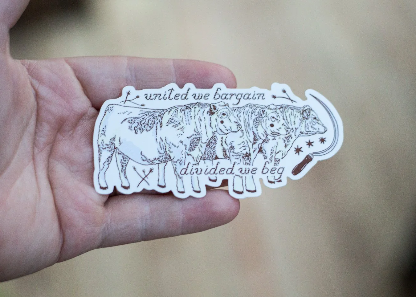 Sticker reads "united we bargain divided we beg"