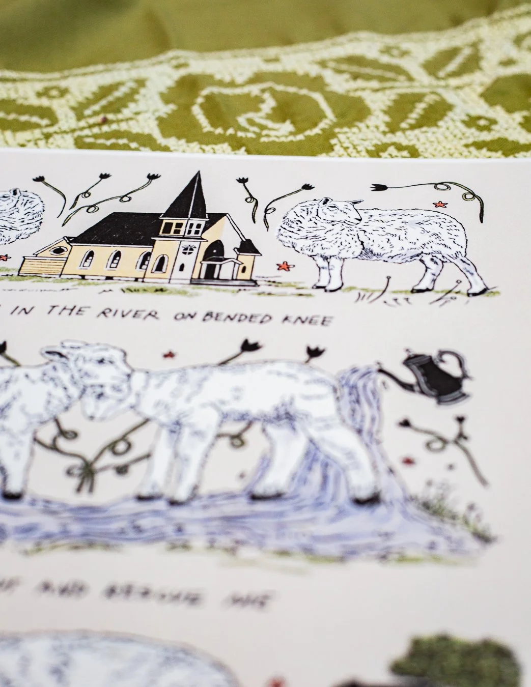 Sheep print reads "Wash in the river on bended knee, Mama come out and rescue me"