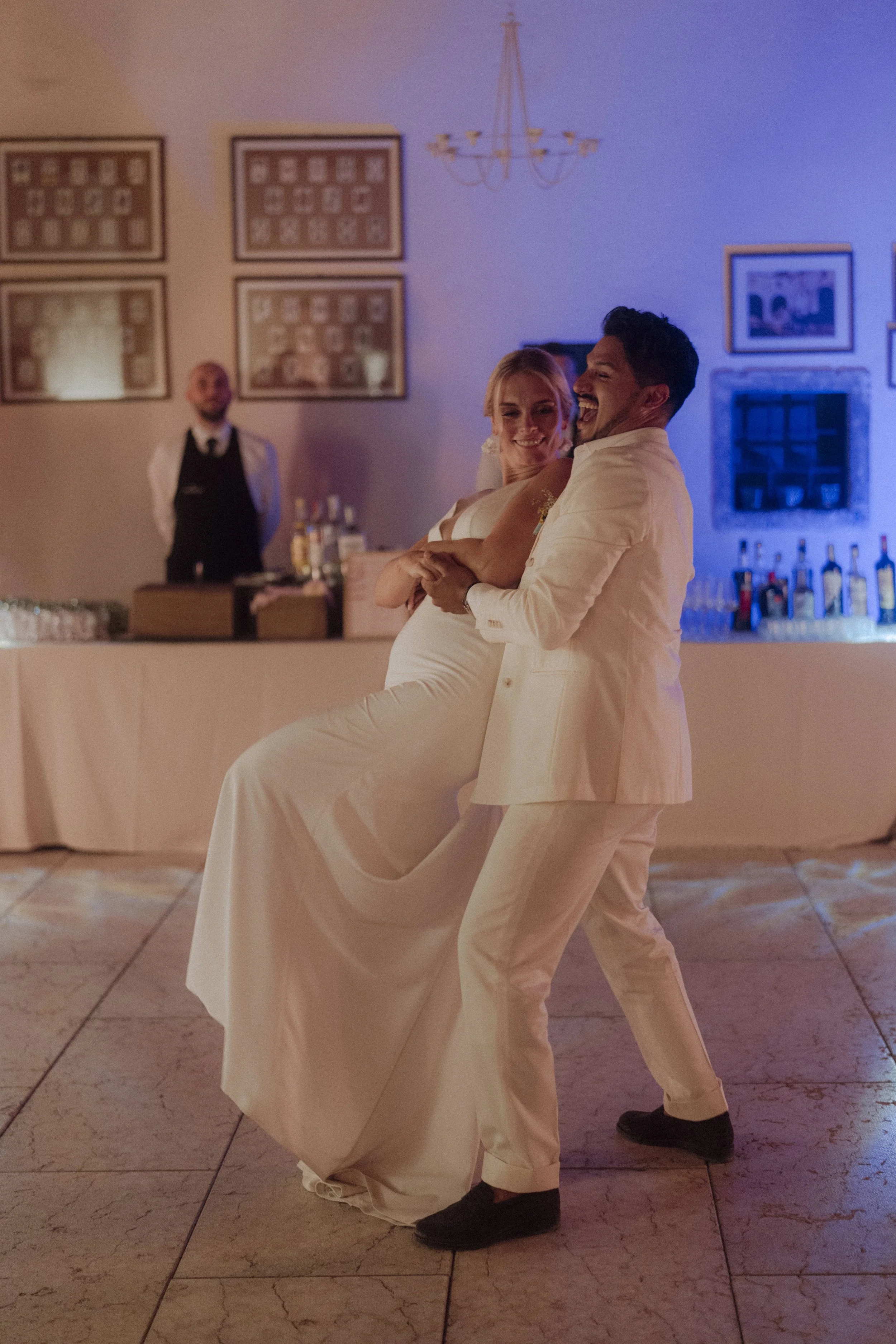 Carolin and Fabio performing a surprise Latin first dance in the courtyard
