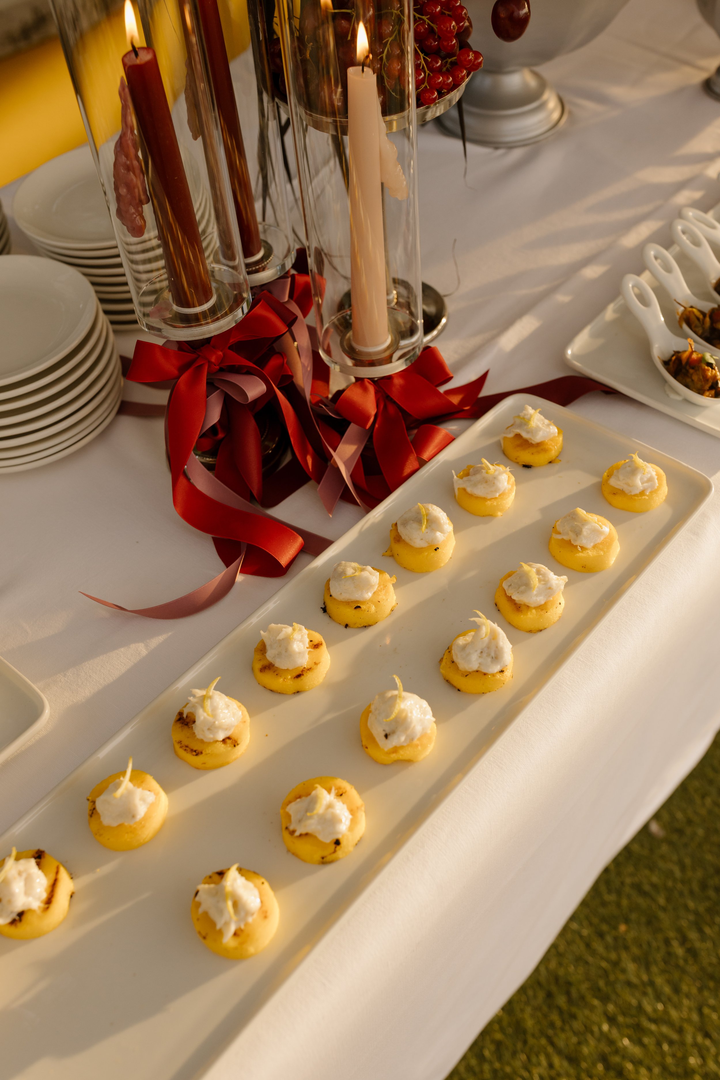 Atmospheric welcome cocktail party on a Venetian rooftop terrace with traditional cicchetti.