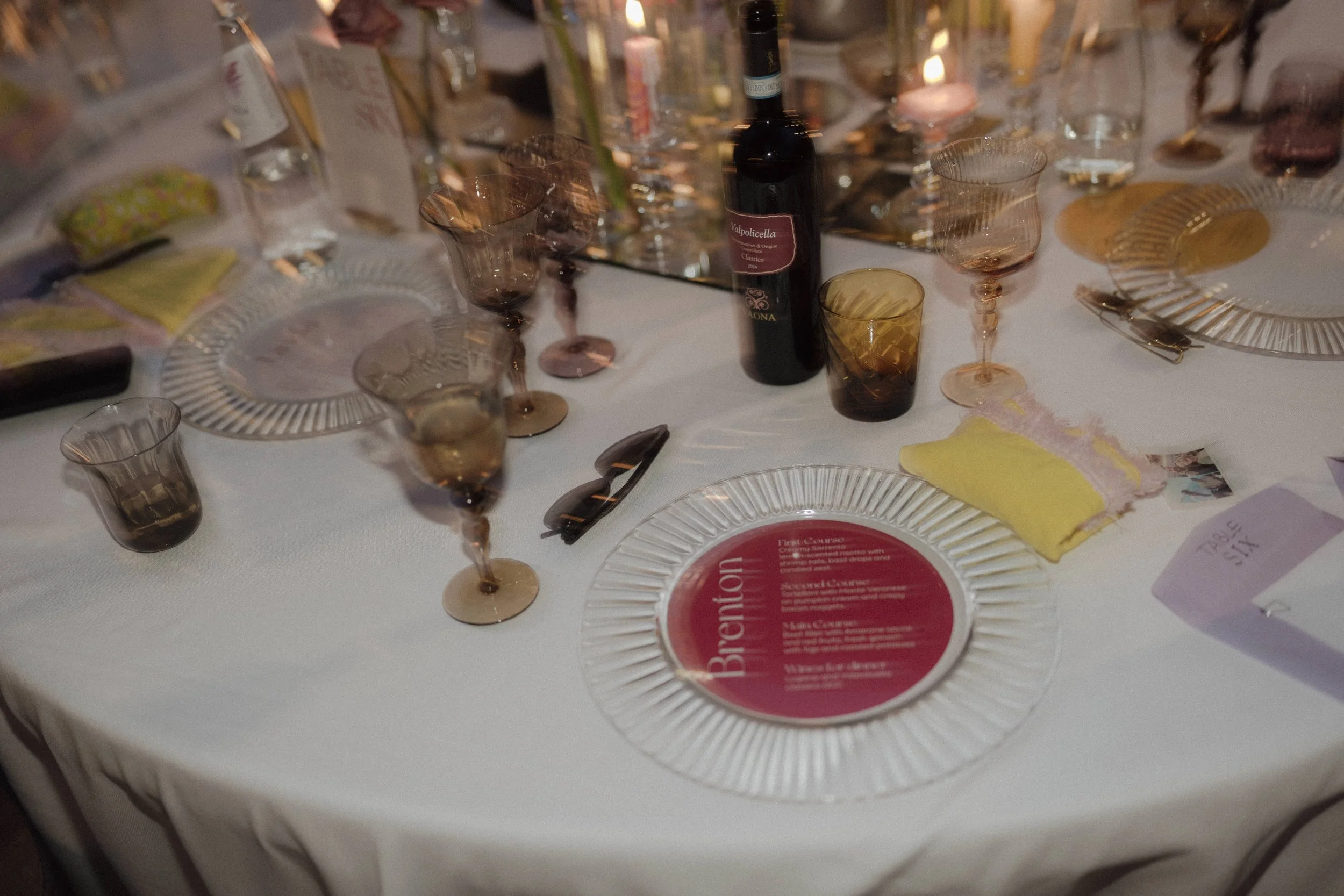 Atmospheric outdoor wedding dinner setup with candles under the stars in Verona
