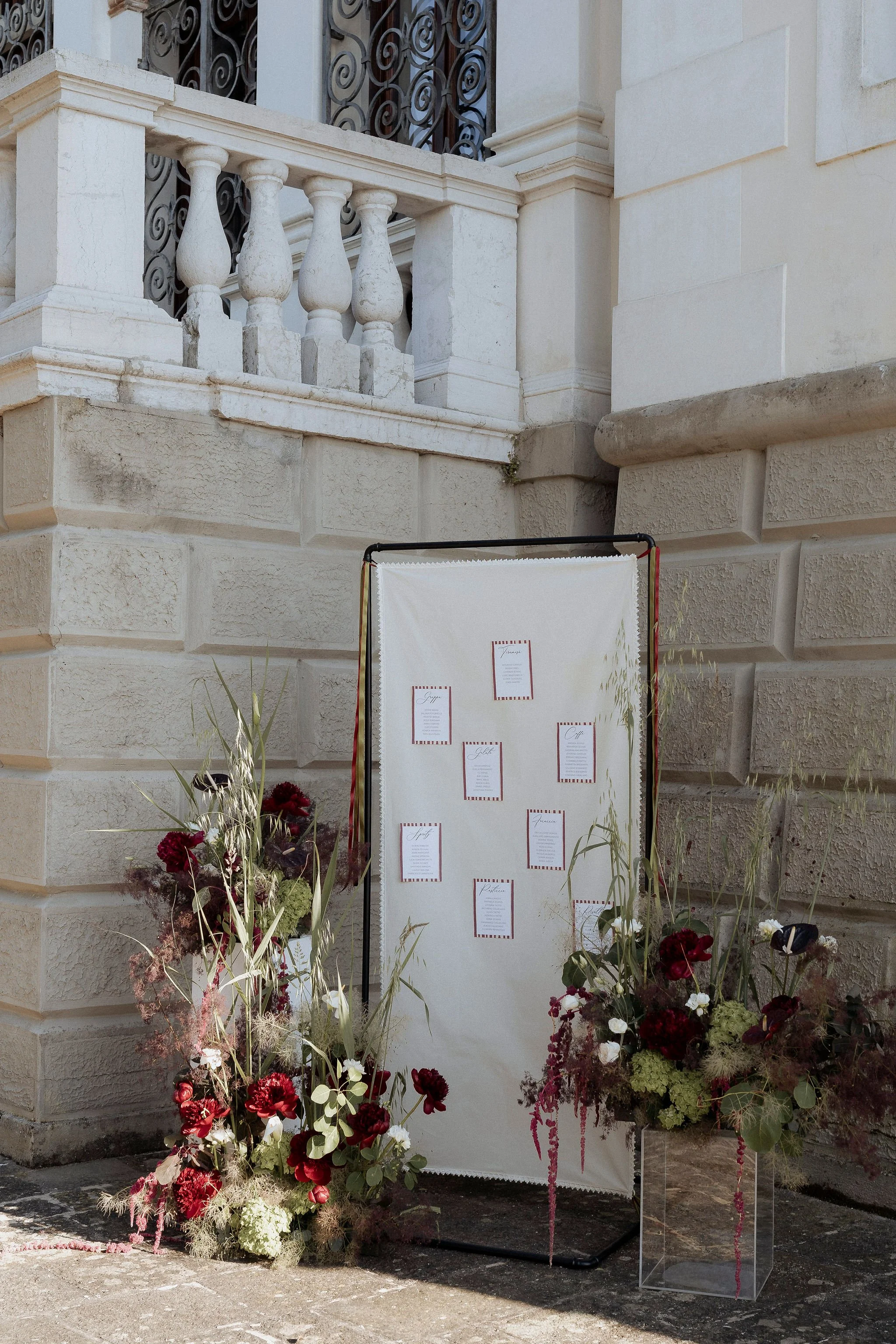 Elegant wedding tableau with olive green and burgundy details.