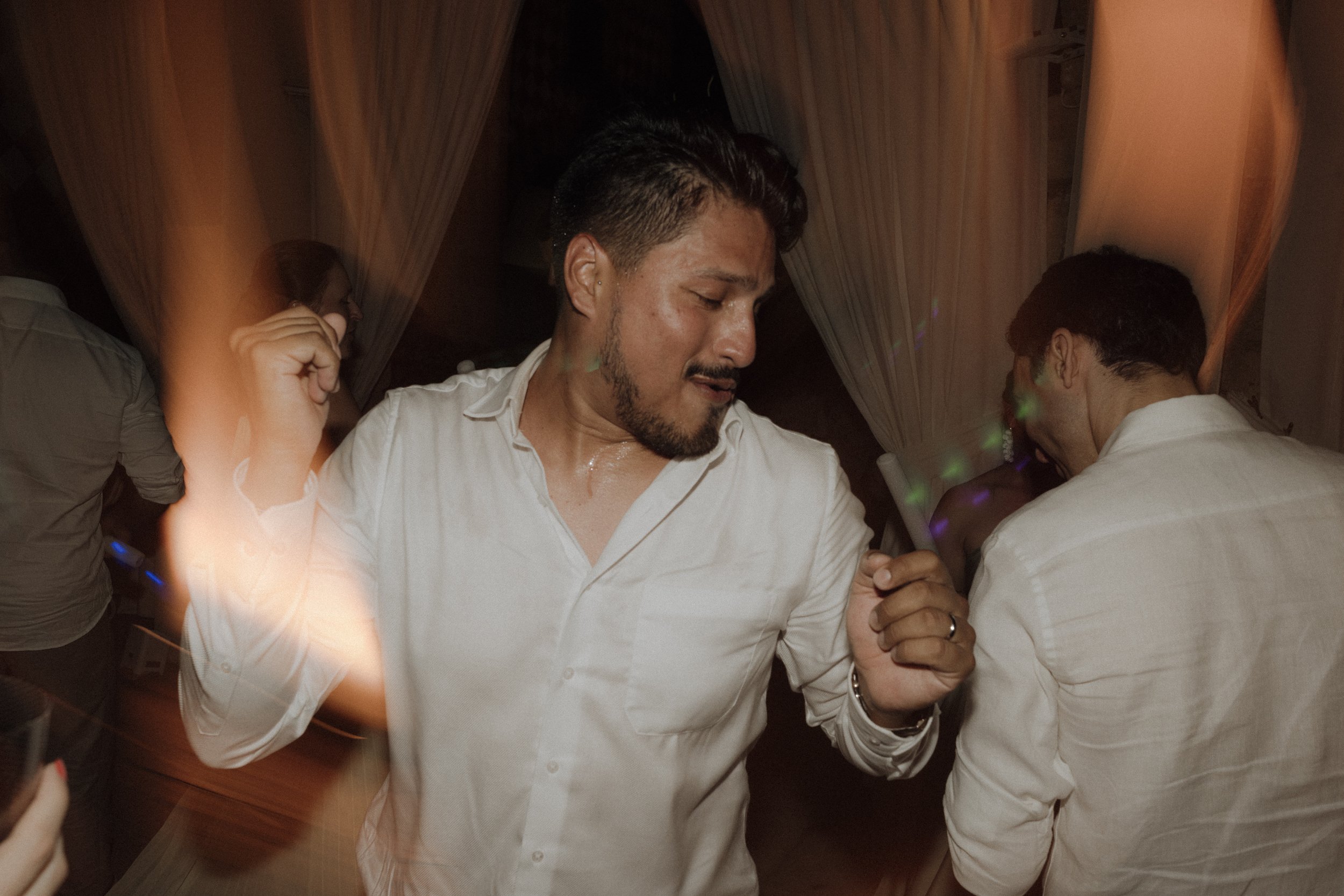 Wedding guests dancing and celebrating at a outdoor party in Verona villa