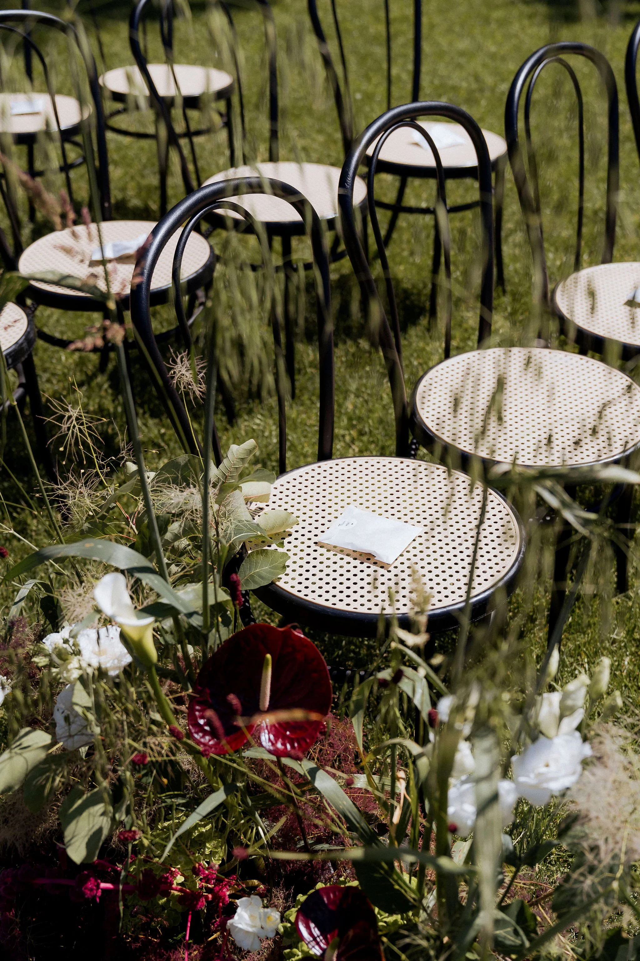 Outdoor wedding ceremony chairs at Villa Selvatico with flower compositions
