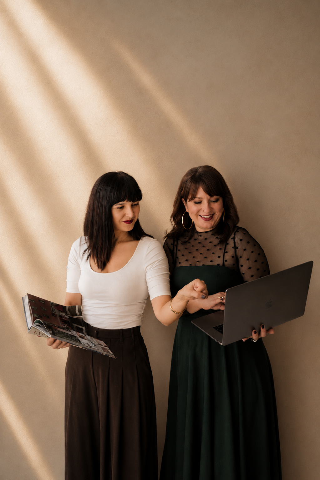 Wedding planners at work with laptop and books