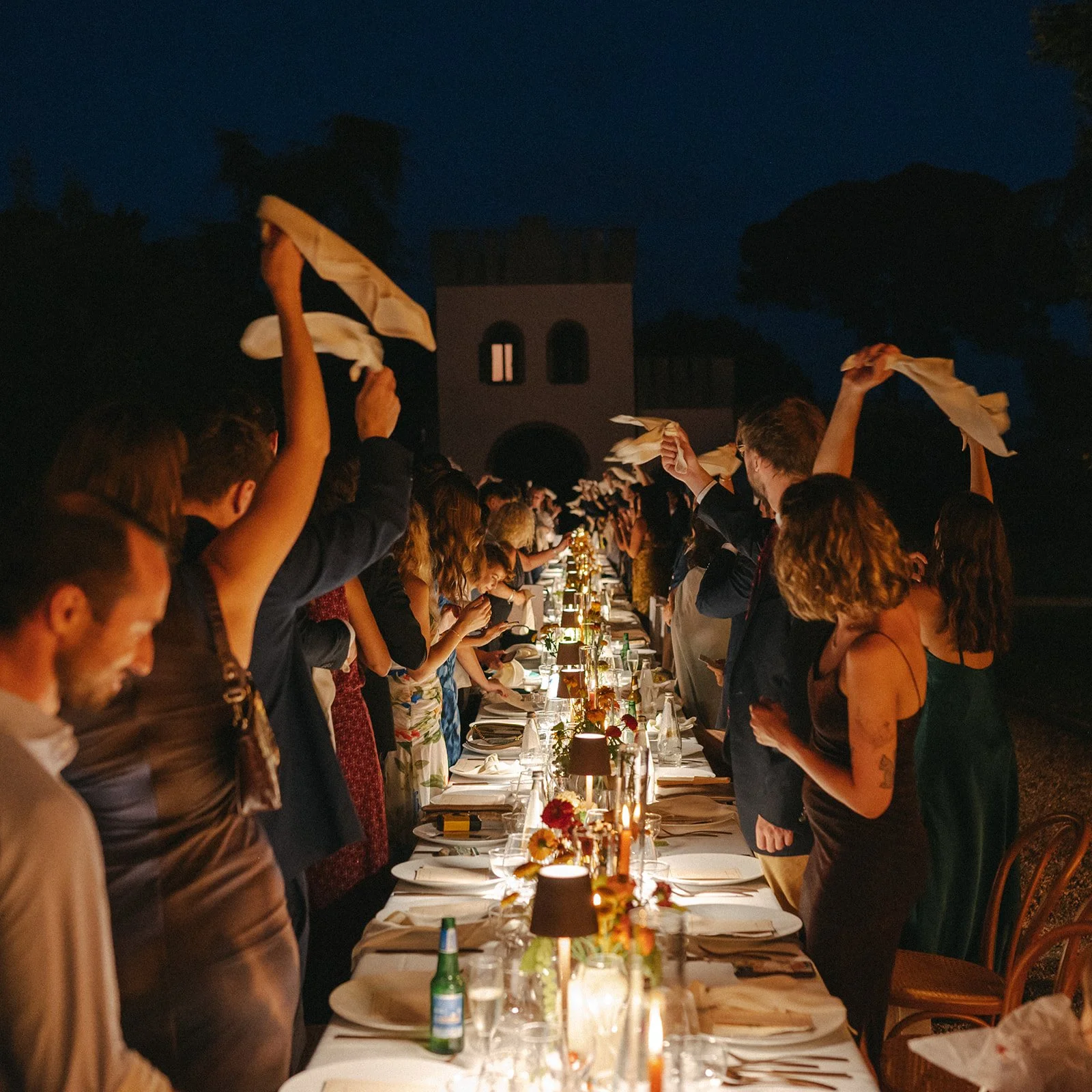 people enjoying dinner at wedding in Italy