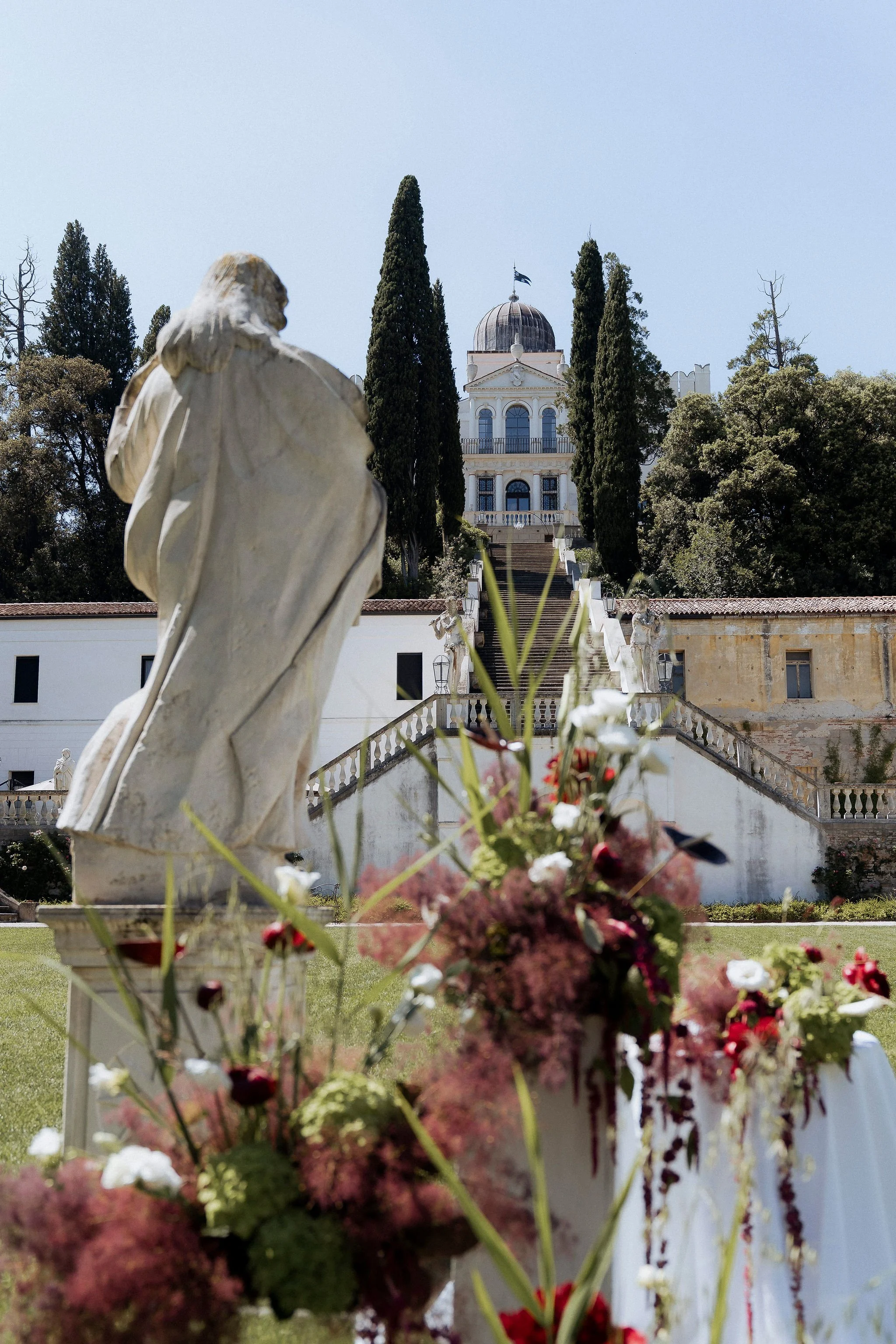 Outdoor wedding ceremony on the lawn at Villa Selvatico with the monumental staircase in the background.