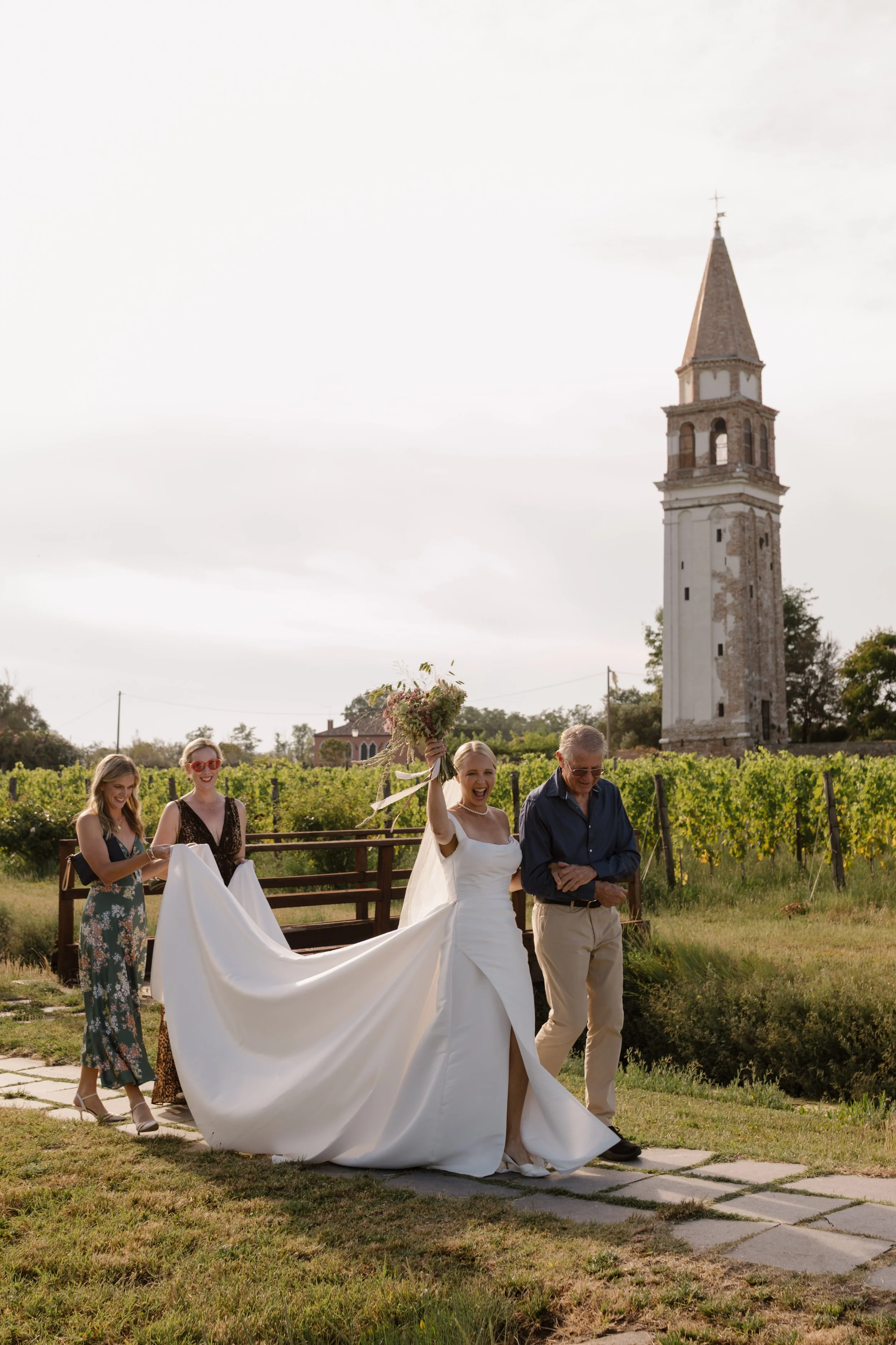 Outdoor wedding ceremony inside the walled vineyard at Venissa on Mazzorbo island, Venice.