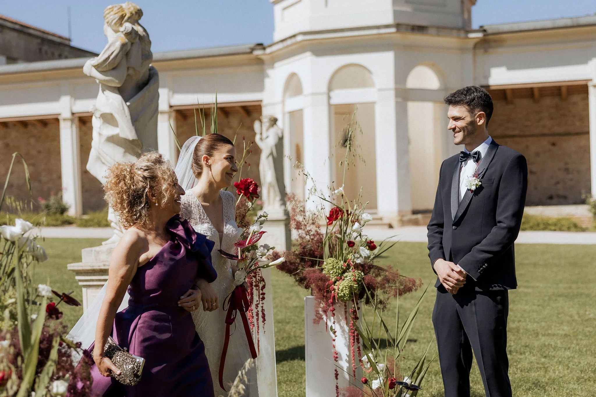 Bride and groom smiling during the ceremony at Villa Selvatico.