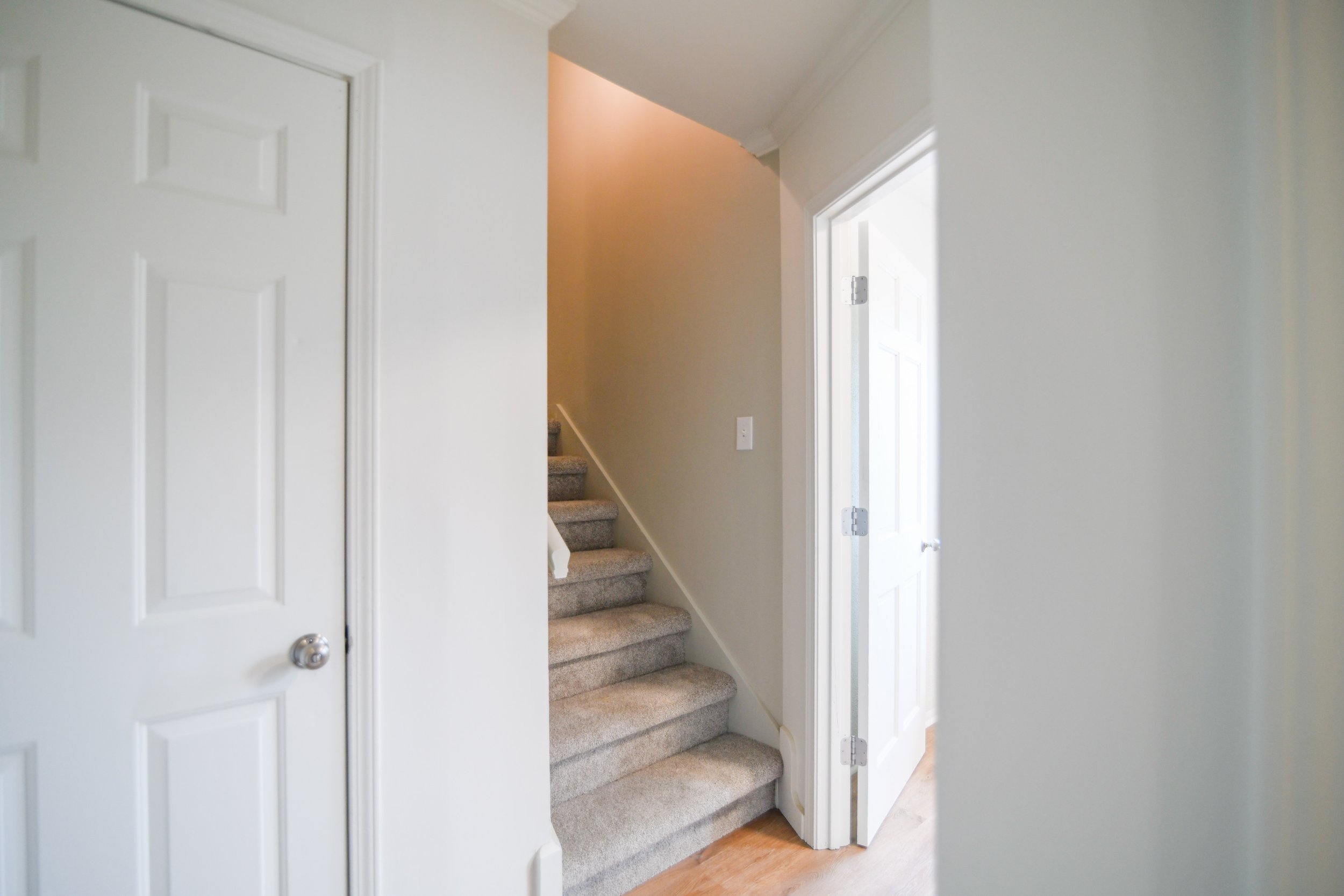 Bonus rear staircase provides convenient secondary access to the second-floor bedrooms