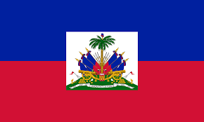The flag of Haiti with blue and red horizontal stripes and a white square in the center featuring a coat of arms with a palm tree, cannons, flags, and a banner.