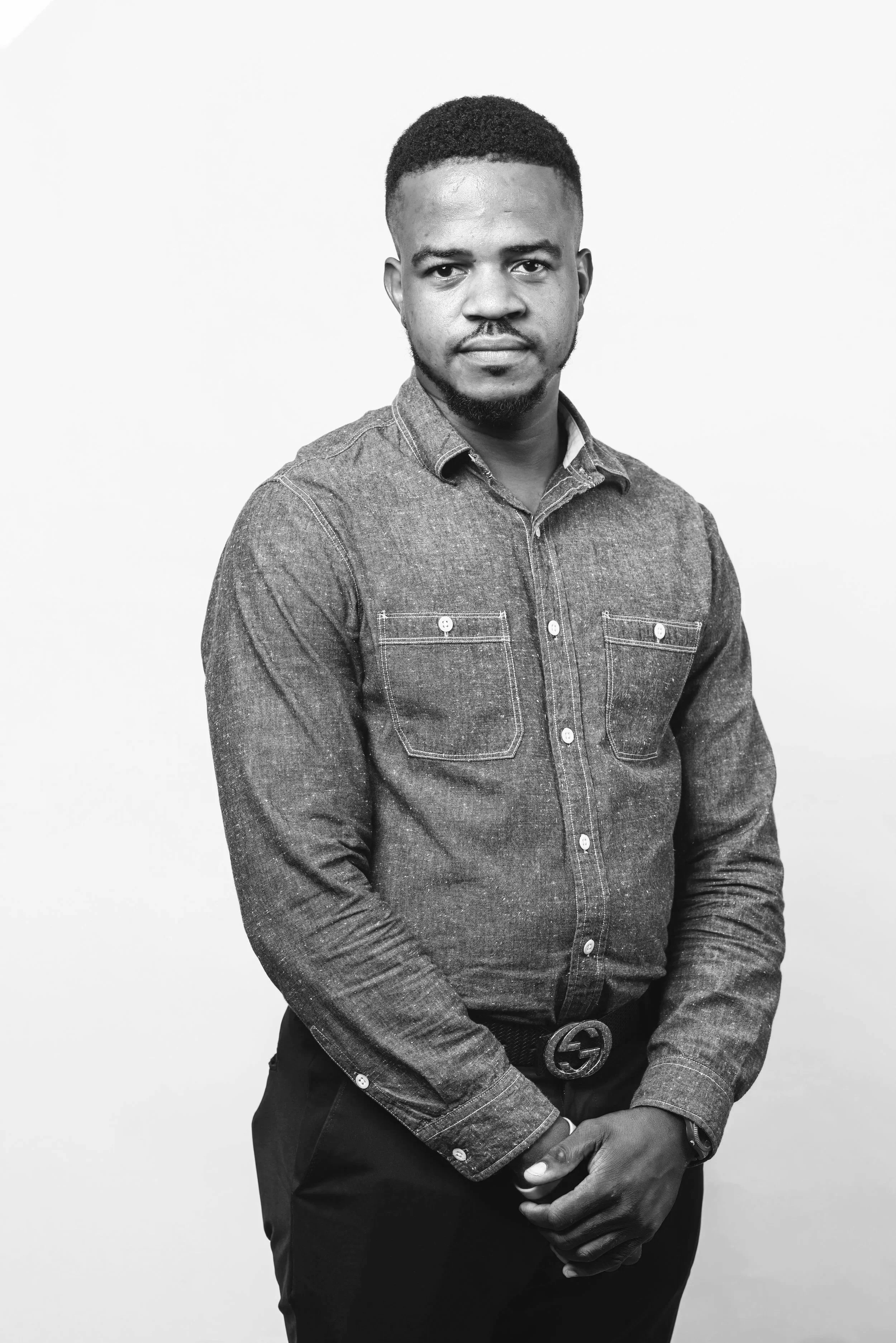 Black and white portrait of Junior Bazile, Messenger at Delespinasse