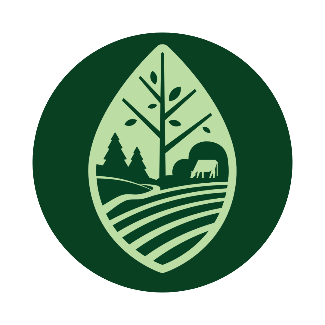 Green and light green emblem featuring trees, a barn, and a gently rolling hillside, representing agriculture and nature.