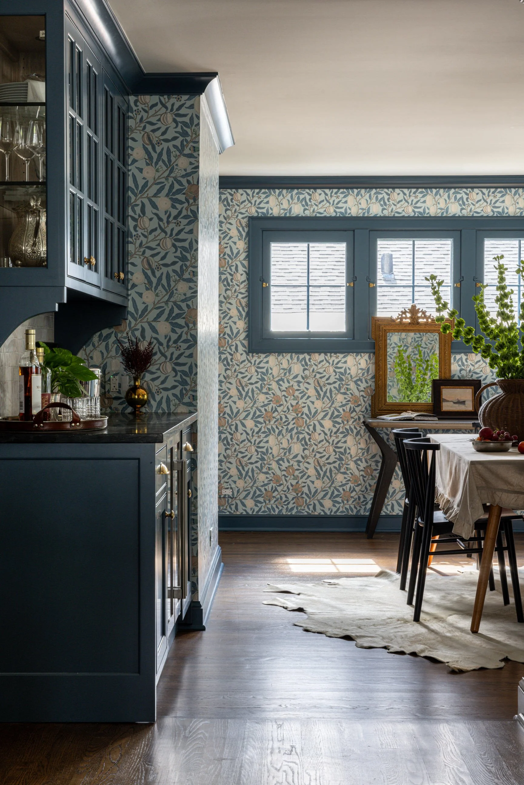 wallpaper and custom millwork for this kitchen nook and dining space