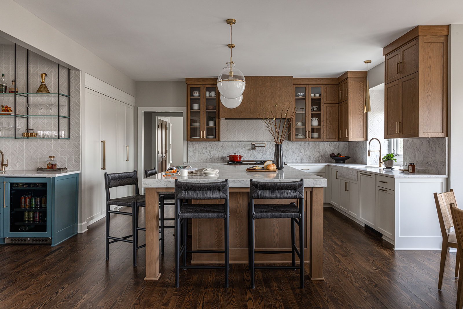 open concept kitchen with warm wood tones paired back to neutrals 