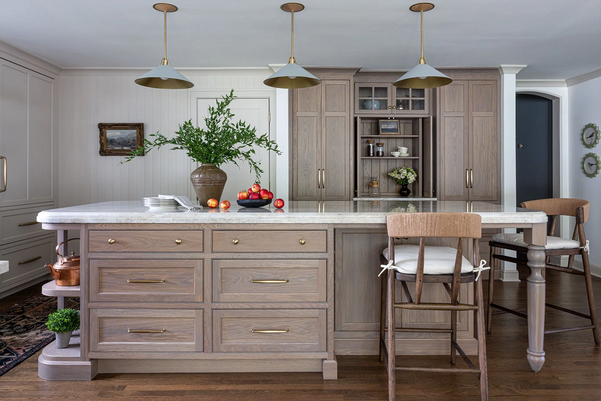 white oak kitchen cabinets and island with coffee bar.