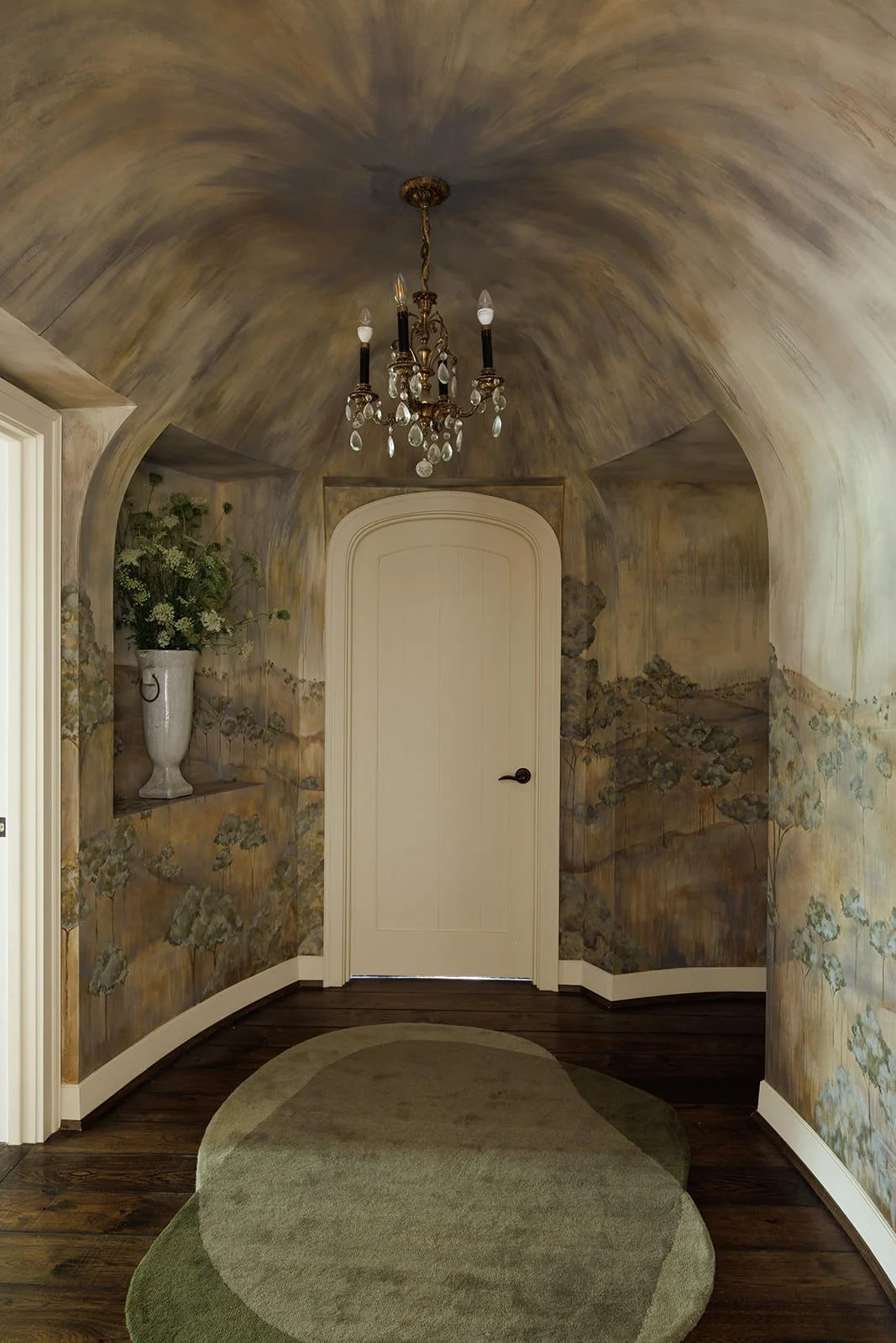 custom hallway design with curved ceiling detail paired back to custom wallpaper design