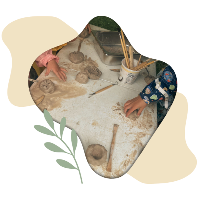 Children sculpting with clay at an outdoor table during a Learning Circles homeschool activity.