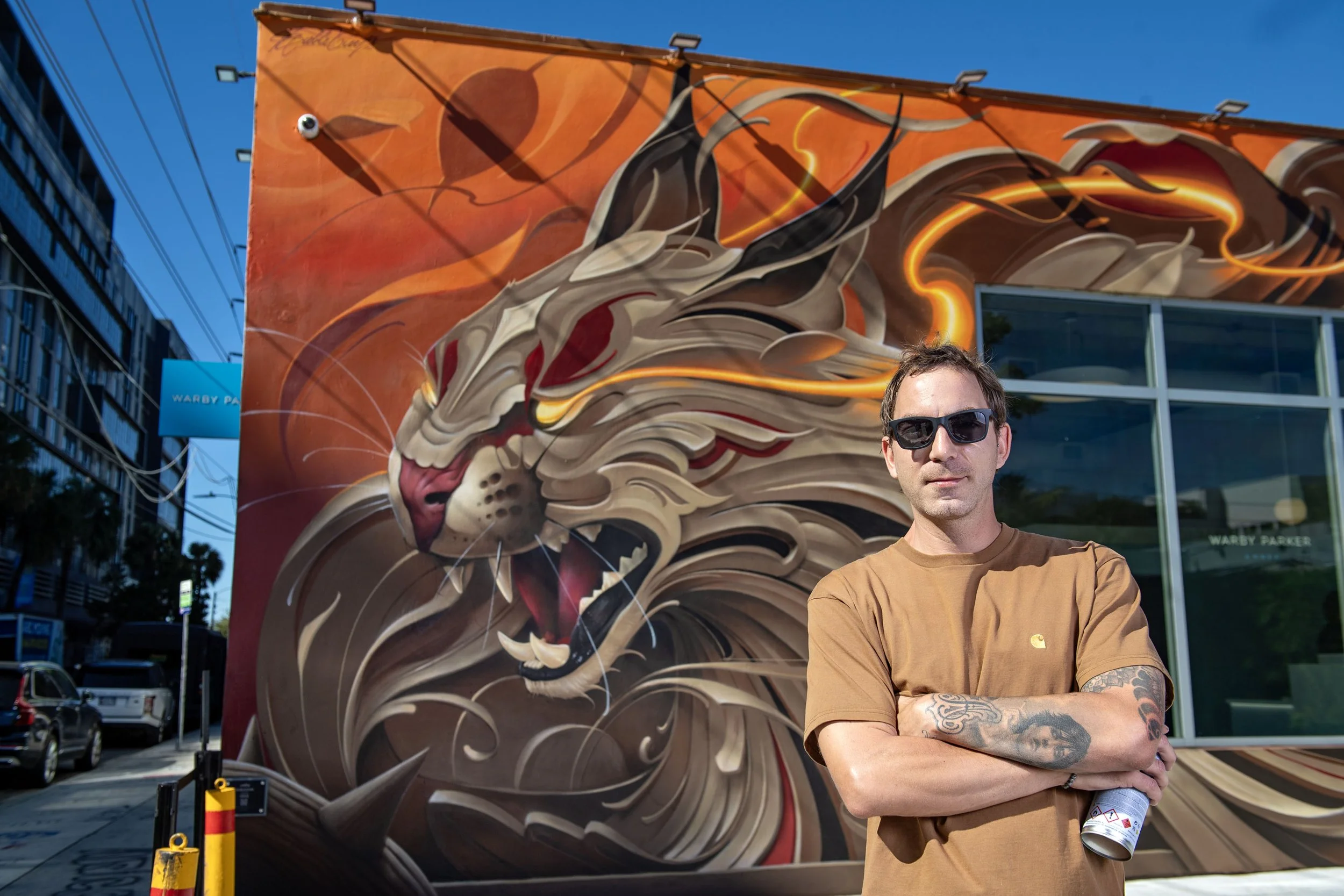 Spanish award-winning artist Bublegum (Tirso Paz) posing with his artwork. A world-class muralist with an international career, known for creating the Ornamental Style and blending fine art with monumental urban interventions.