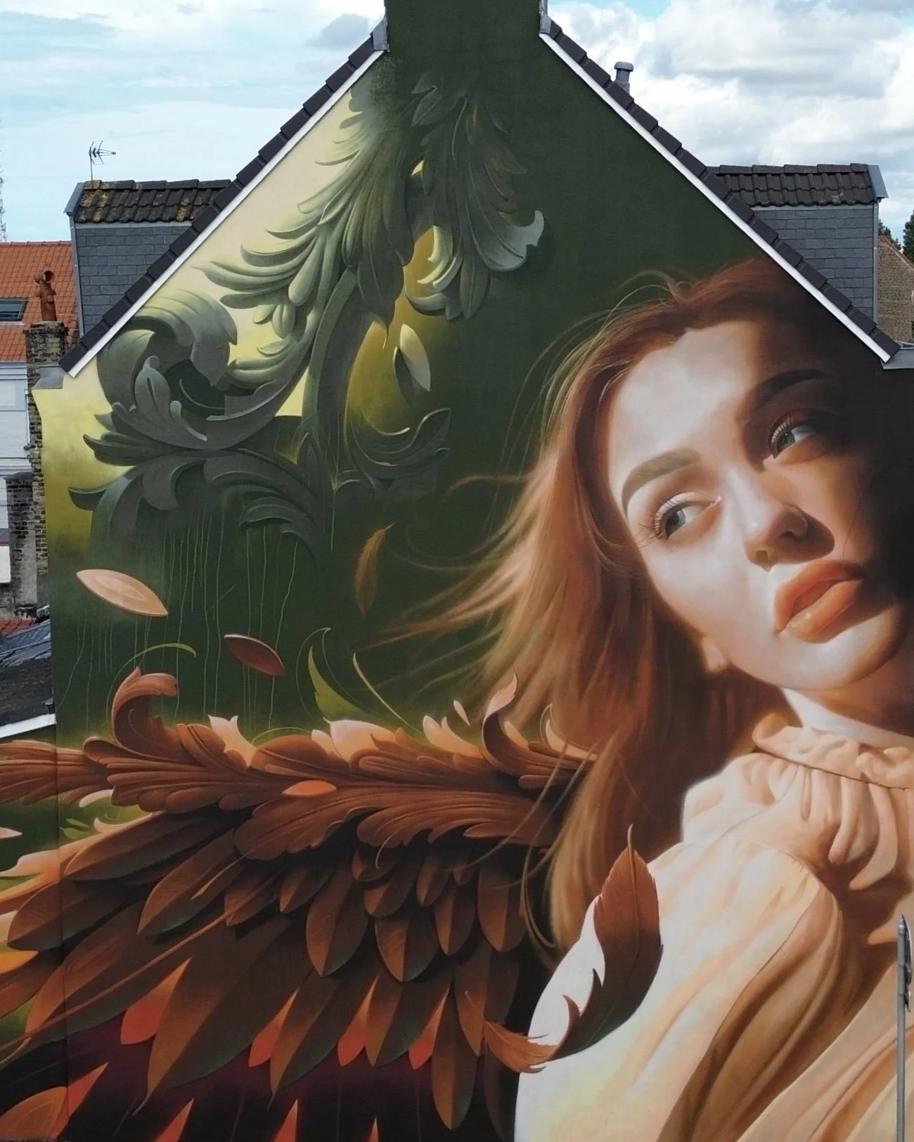 The "Ornamental Angel 2" monumental mural by Bublegum (Tirso Paz) in Calais, France. A majestic urban art piece featuring a celestial figure in the signature Ornamental Style.