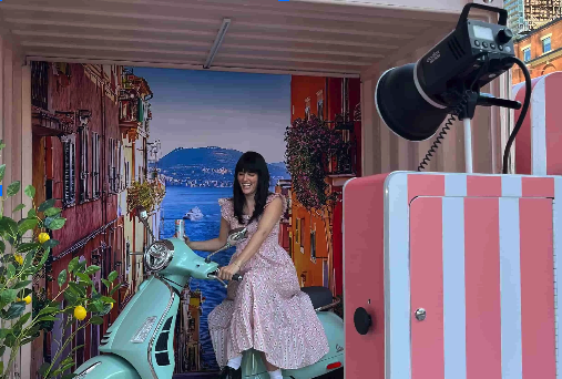 Guests using a photo booth rental at a live event.