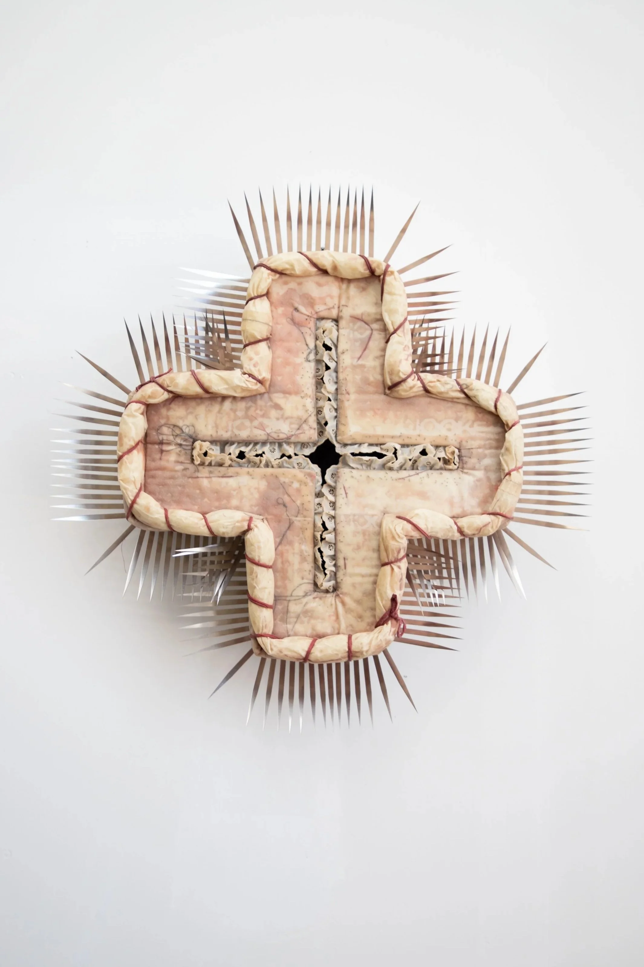 "Tissue Box, V. 4. (Hairless)". Beeswax, pigment, thread, mixed fabrics, steel, nails, screws. 
24”L x 24”W x 5”D. 2025. 
