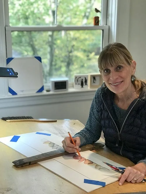 Artist Deborah Friedman using colored pencils in her studio