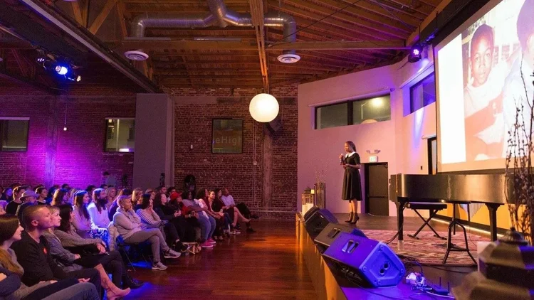Dydine Umunyana Anderson shares her story with a seated audience