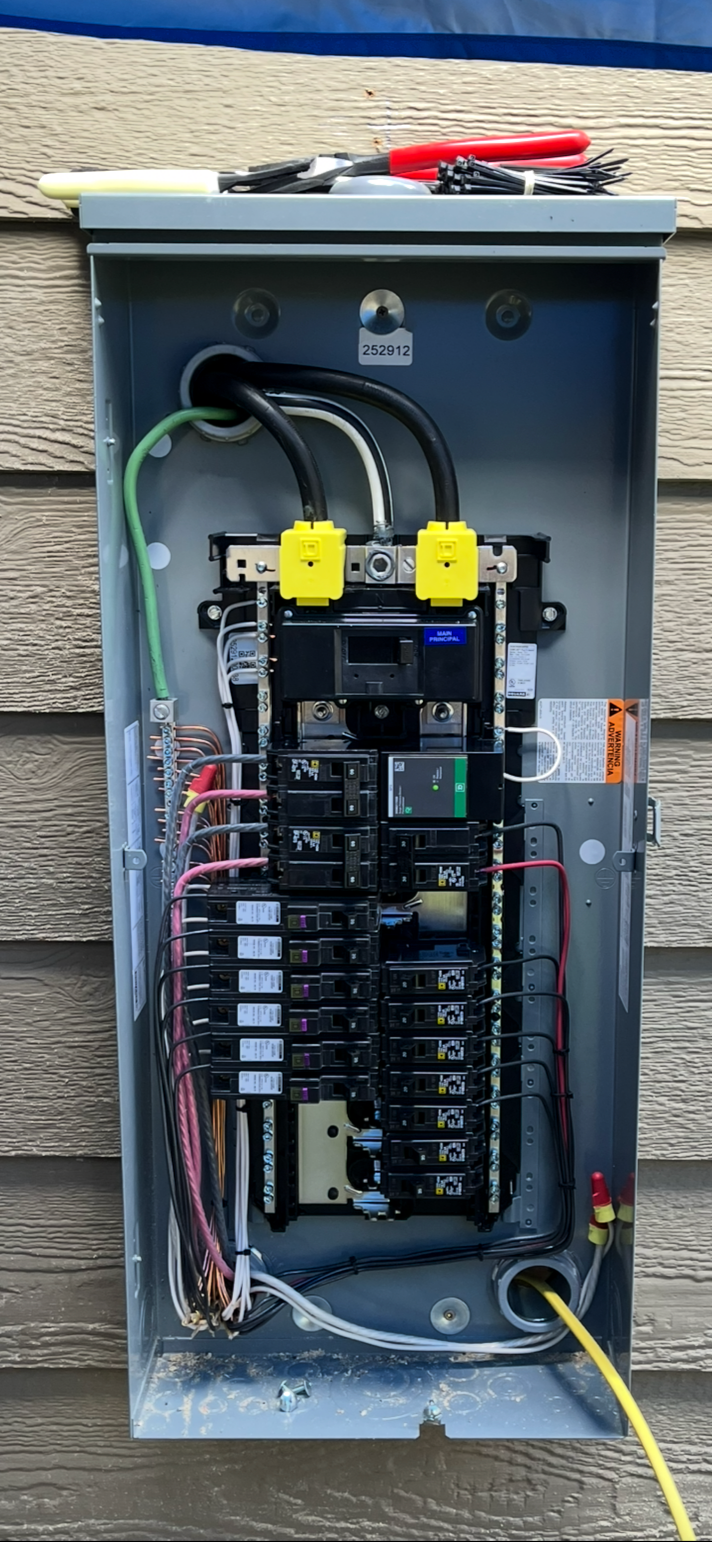 Interior view of a residential breaker panel professionally wired by R&D Power Pros LLC. Showcases neat, code-compliant cable management and Master Electrician workmanship.