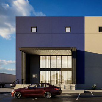 Edificio moderno con fachada azul y beige, con ventanas y un automóvil de color burdeos estacionado frente a la entrada.