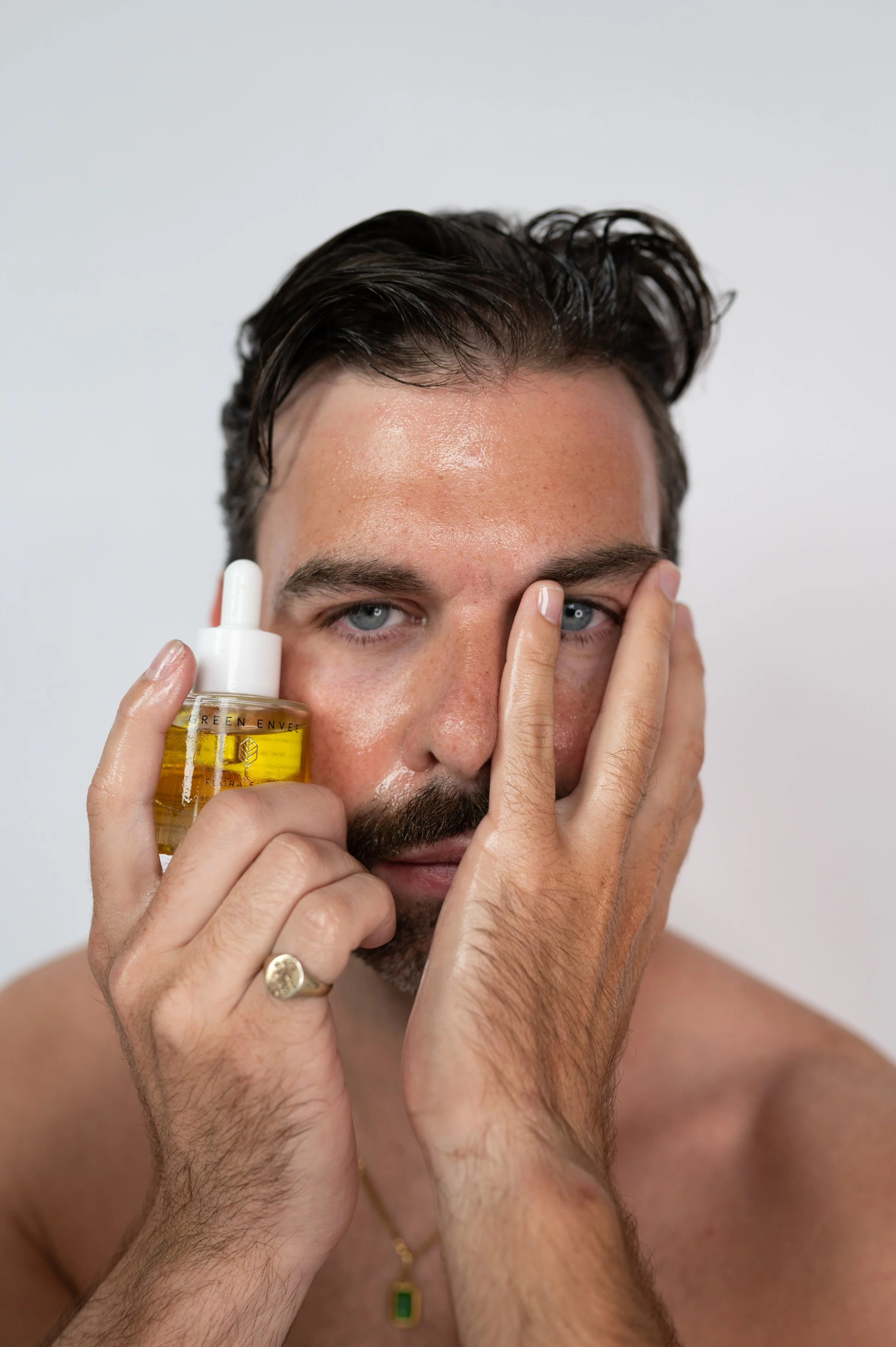 Client with skincare serum at The Aesthetics Club Nashville