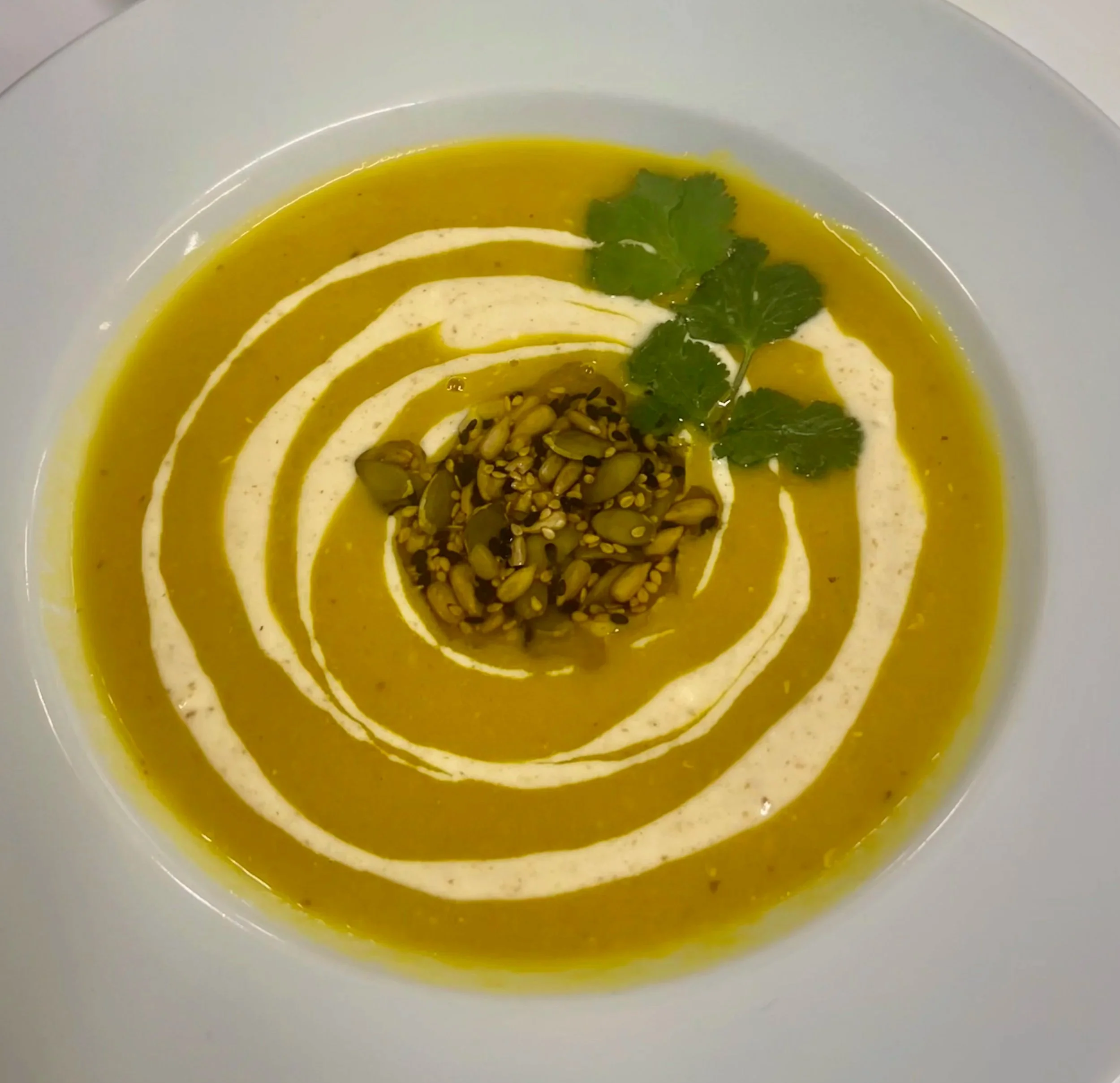 red lentil and tumeric with yogurt masala and toasted pumpkin and sesameseeds garnish