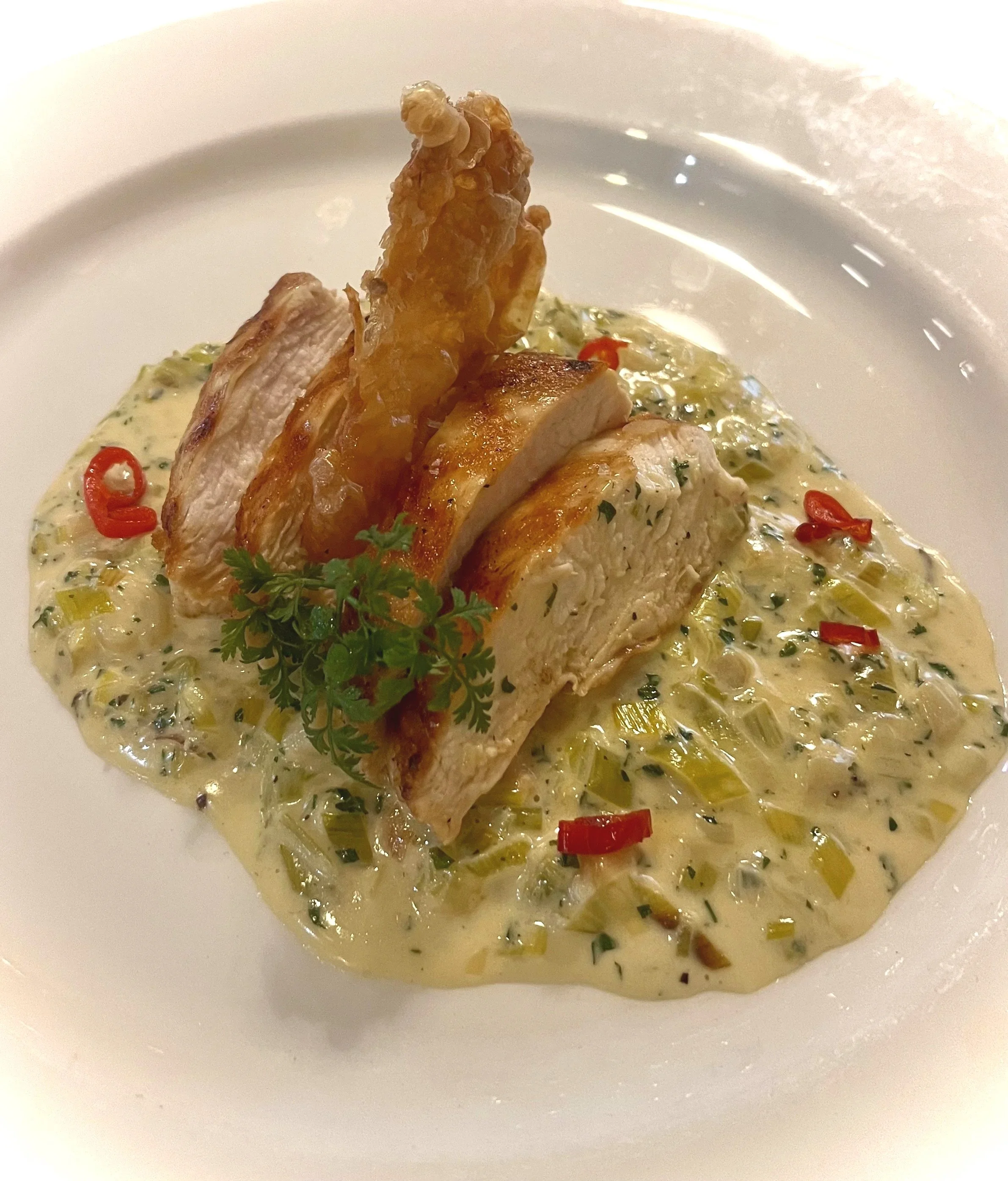 creamy leak and chervil with grilled chicken breast
