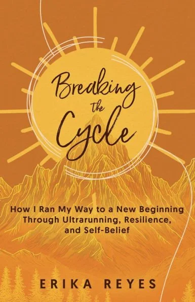 A book cover titled 'Breaking the Cycle' by Erika Reyes, featuring a mountain landscape with a sunrise or sunset in shades of yellow and orange, and stylized lines radiating from the circle.