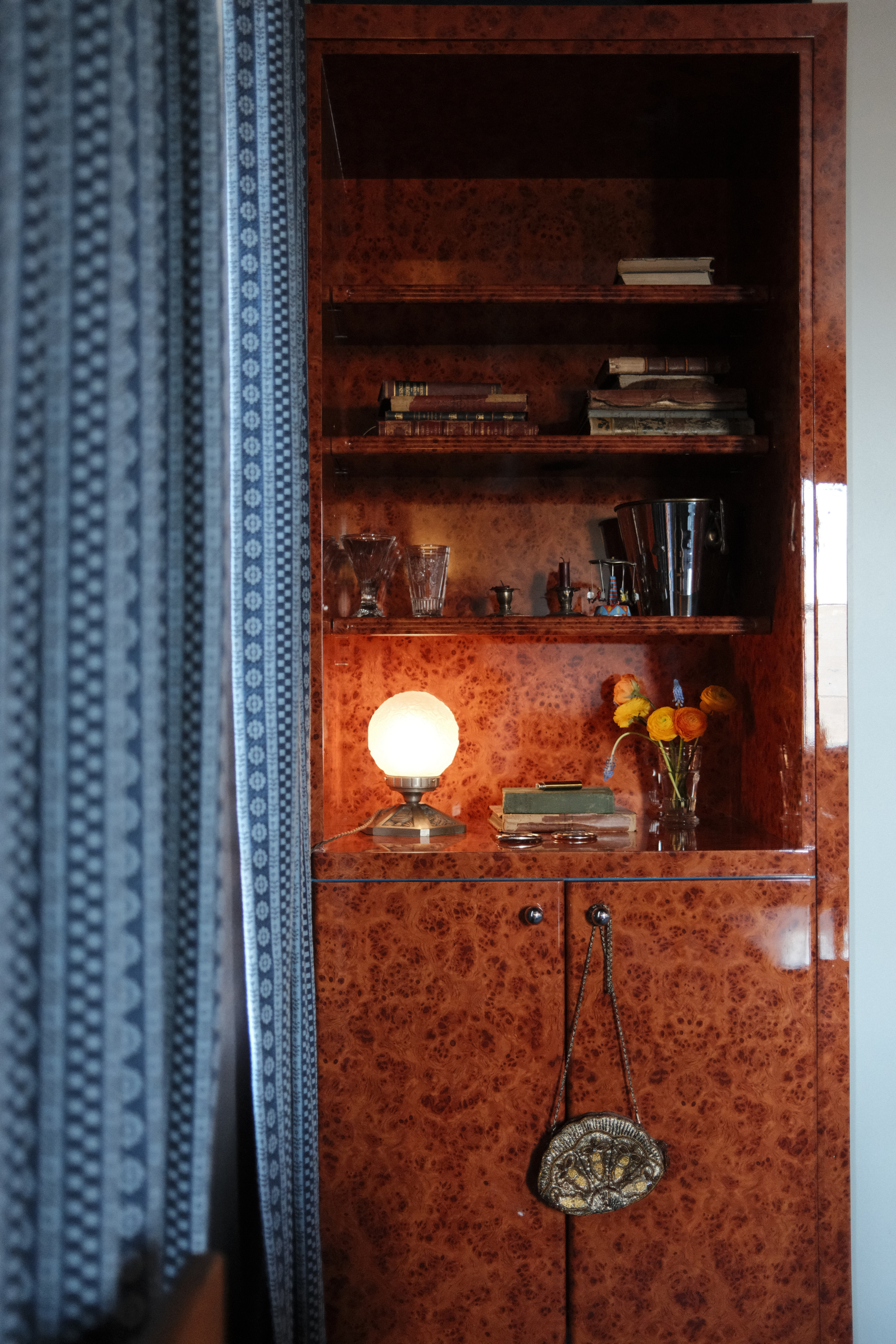 Dasher Suite burl wood shelves and blue curtains