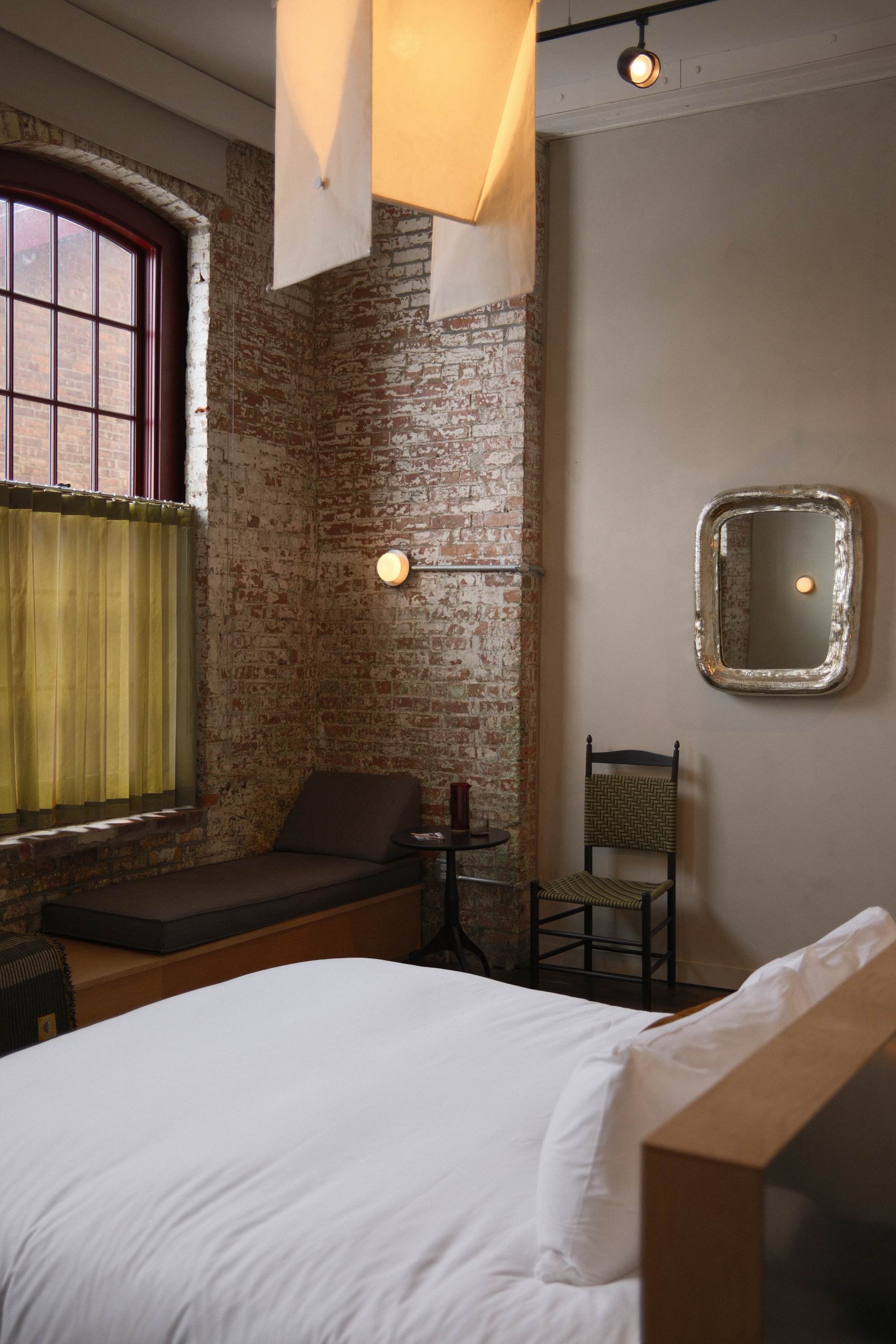 Guest room with bed, seating, and a window