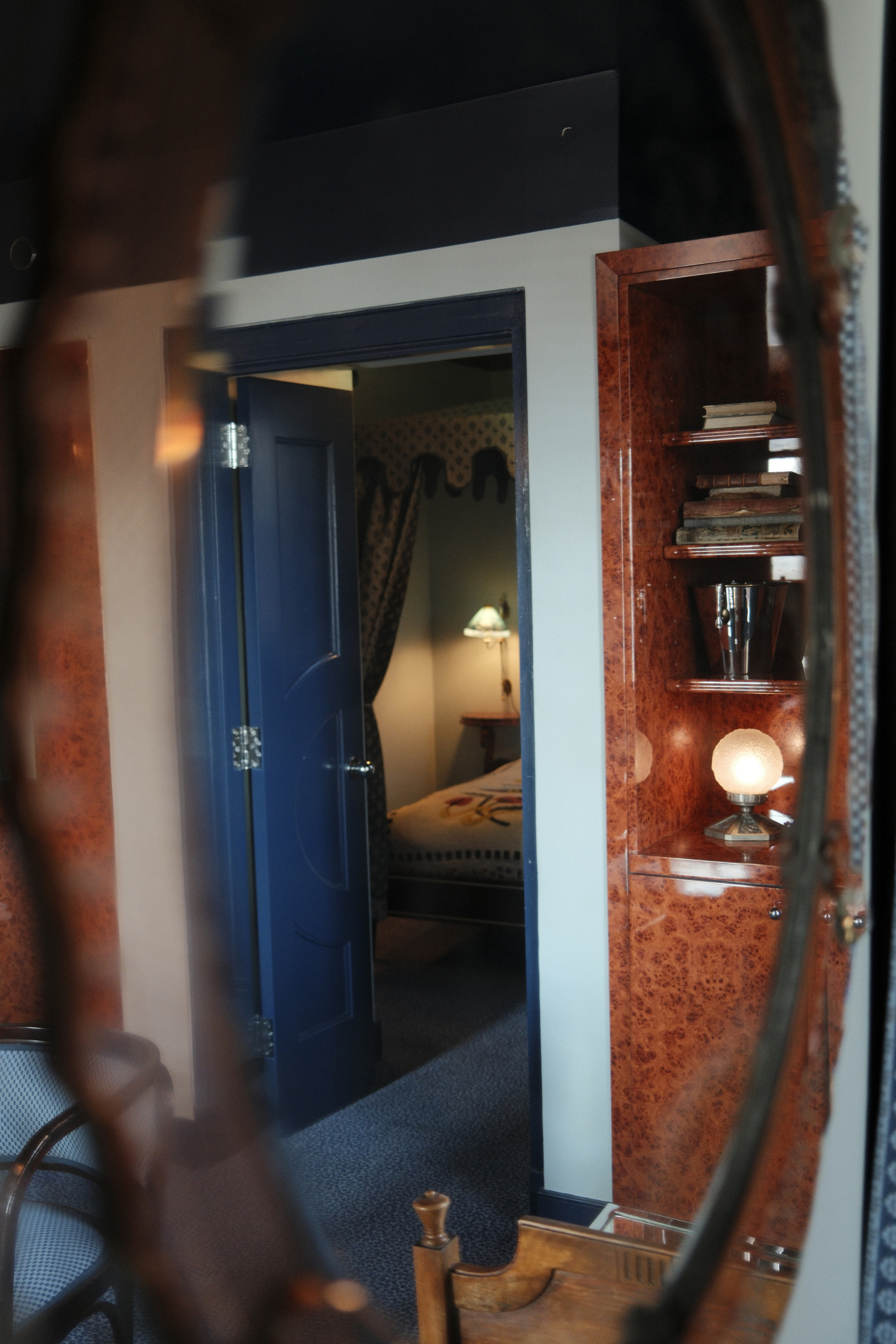Reflection of Dasher Suite bedroom in a mirror