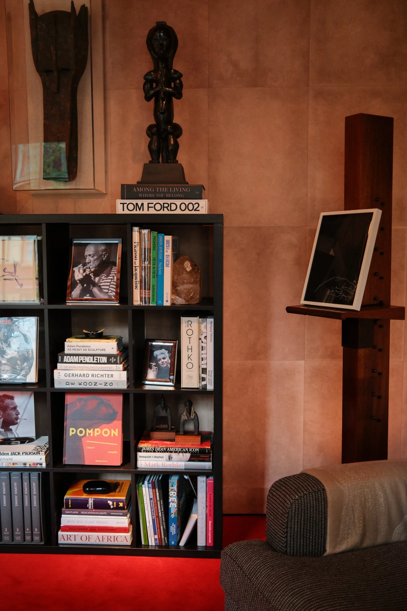 Black bookshelf filled with art books