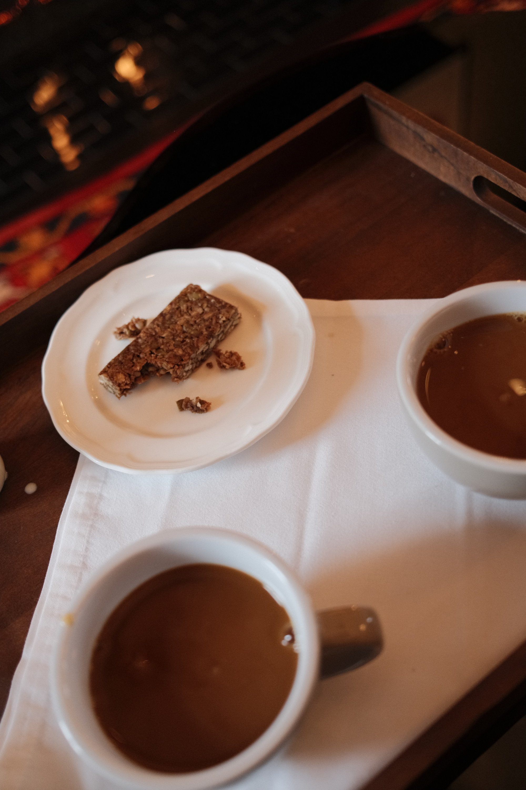 Two coffees and a granola bar
