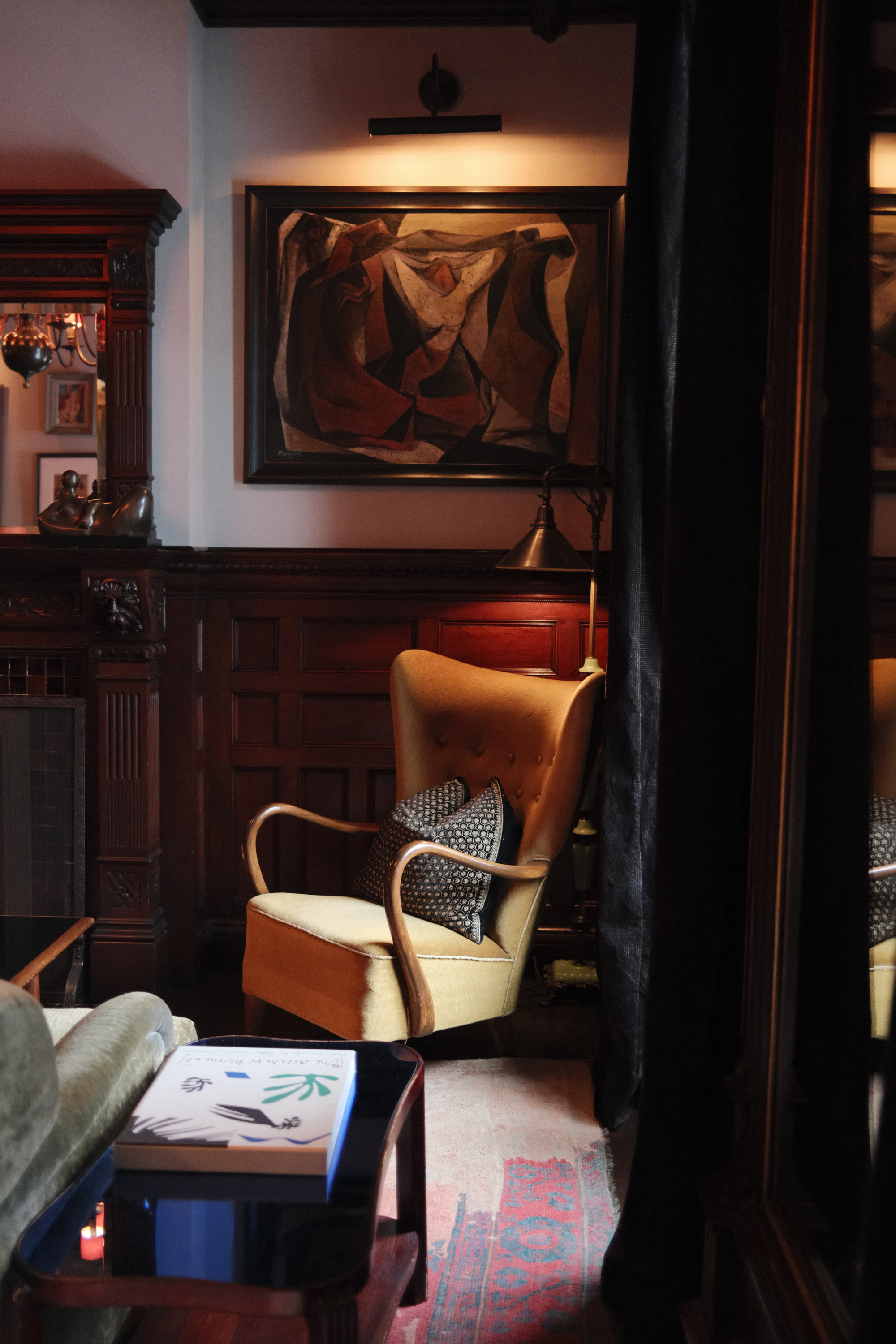 Yellow chair in lounge with art